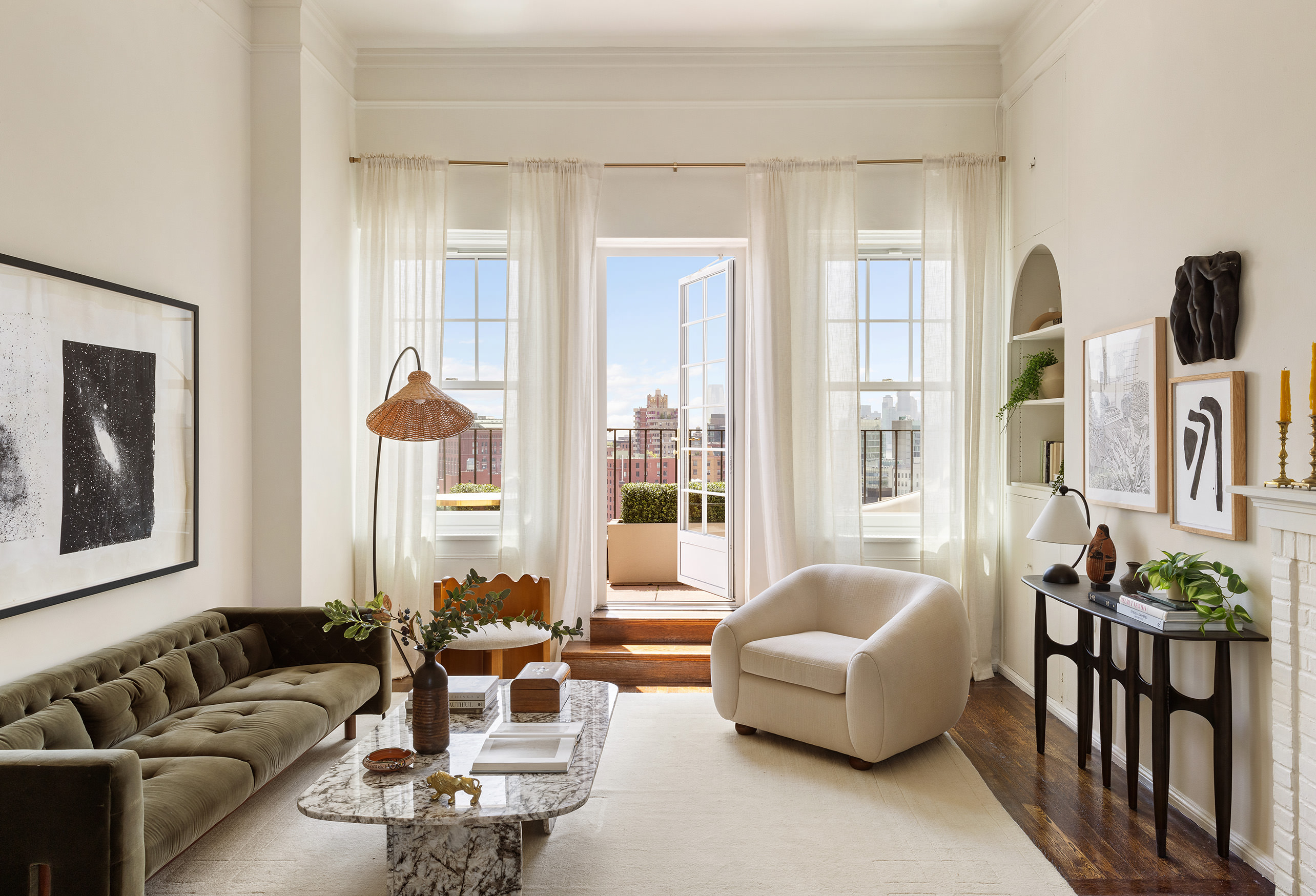 302 West 12th Street, Unit PHE Manhattan, NY 10014 - Photo 4 of 16 a living room with furniture and a large window