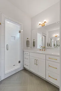 a picture of a bathroom with a shower
