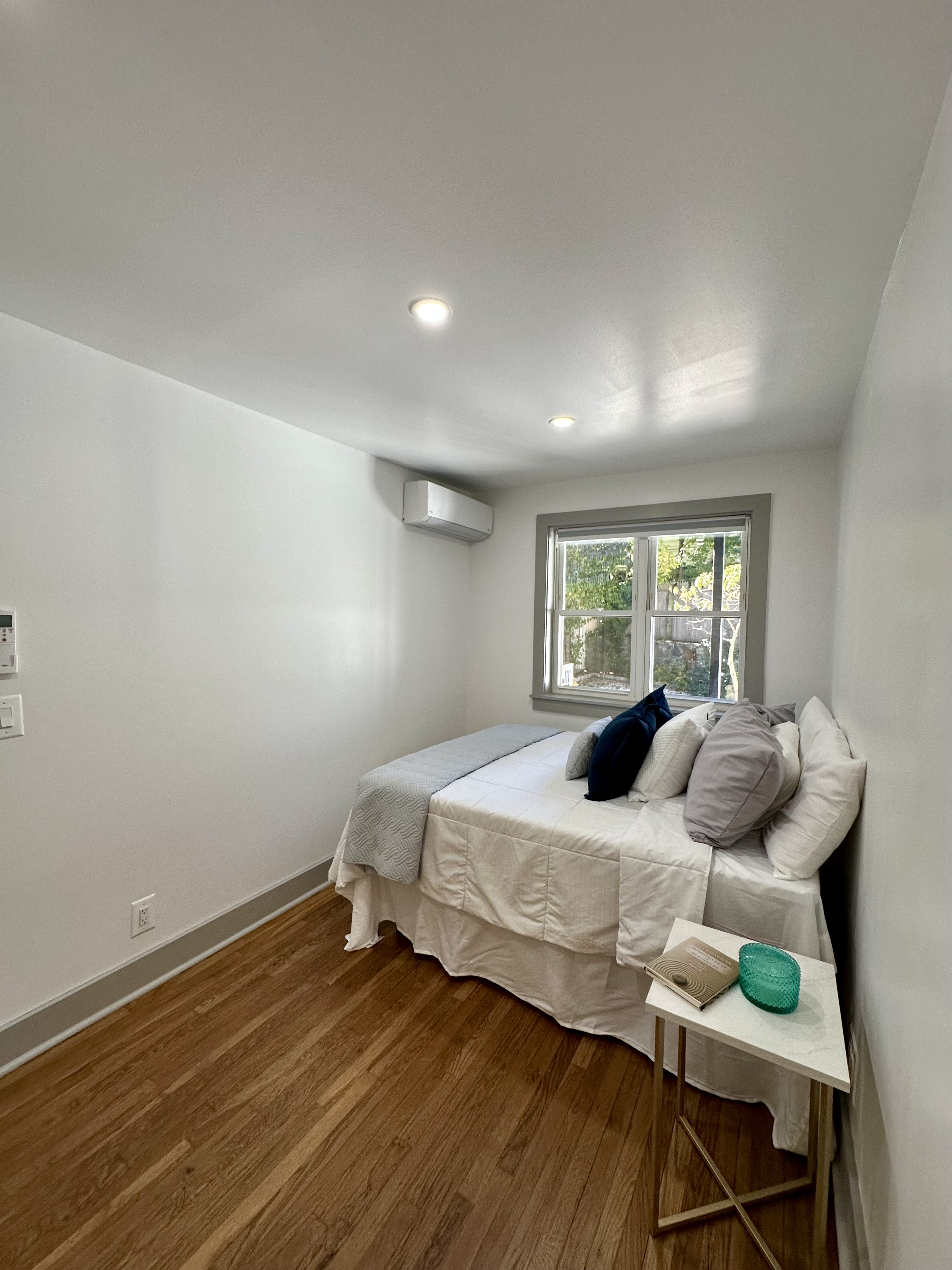 5823 Fieldston Road, Unit 1A Bronx, NY 10471 - Photo 17 of 26 a bedroom with a bed and wooden floor