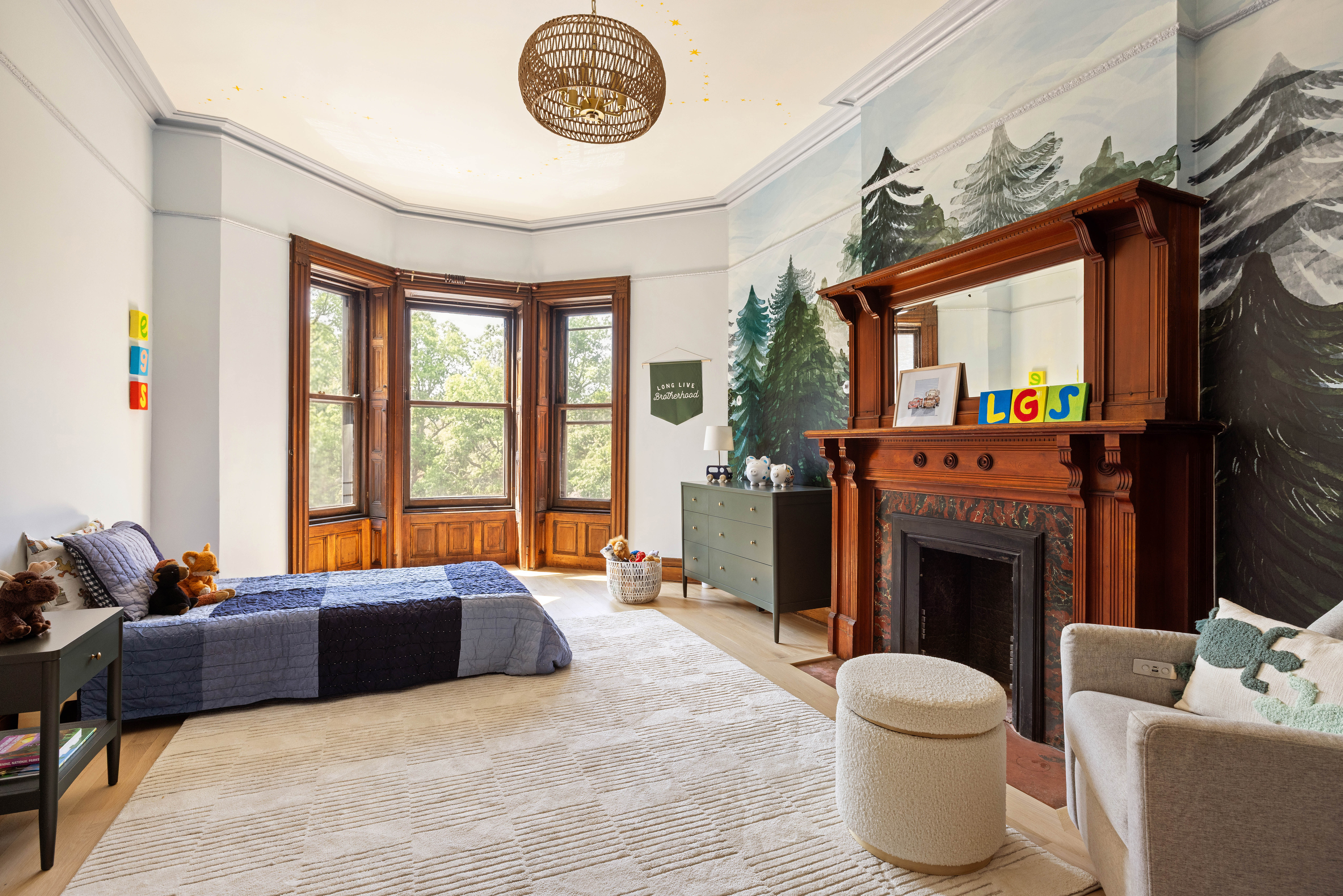 787 Carroll Street Brooklyn, NY 11215 - Photo 23 of 32 a living room with furniture a fireplace and a large window