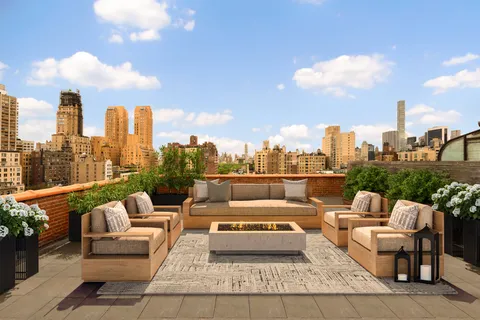 a view of a terrace with furniture