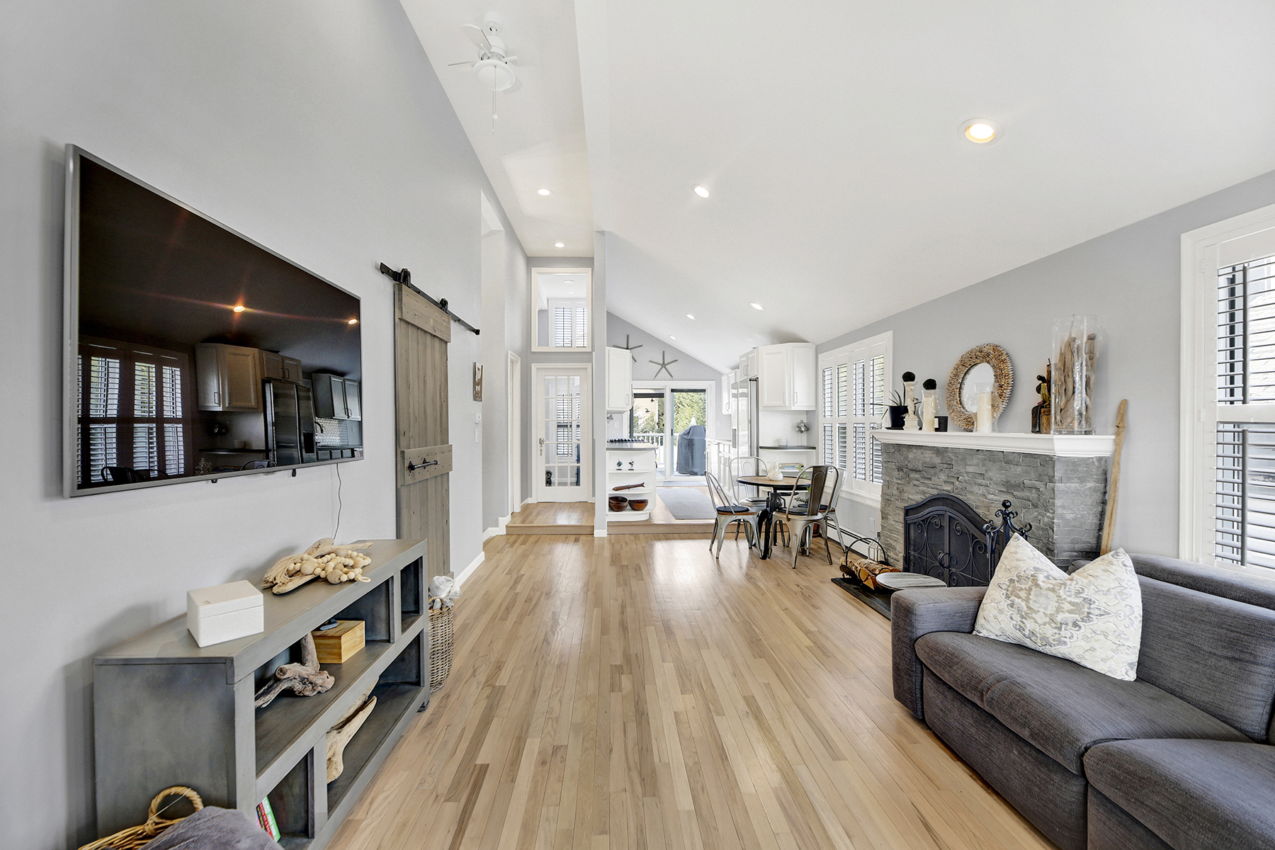 4-53 Beach 142nd Street Queens, NY 11694 - Photo 5 of 39 a living room with furniture and a fireplace