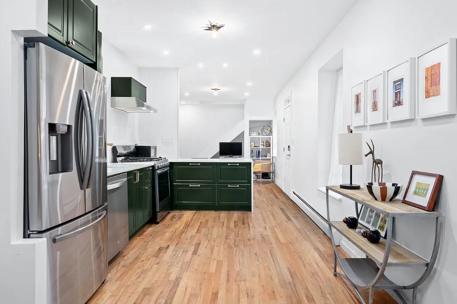 400 West 154th Street, Unit 1 Manhattan, NY 10032 - Photo 2 of 10 a kitchen with stainless steel appliances a refrigerator a stove a sink and a refrigerator