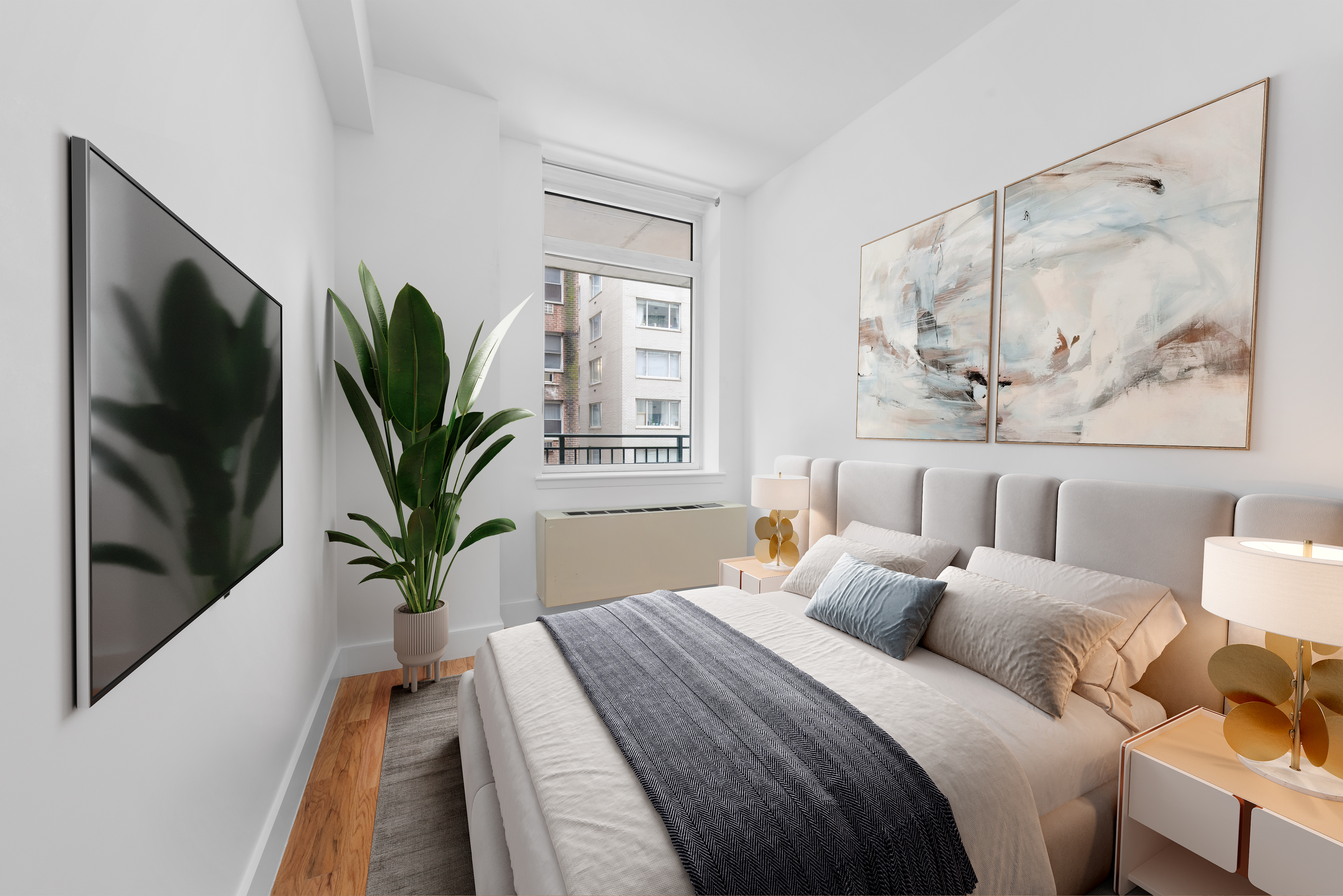 212 East 57th Street, Unit 3B Manhattan, NY 10022 - Photo 16 of 17 a bedroom with a large bed and a potted plant