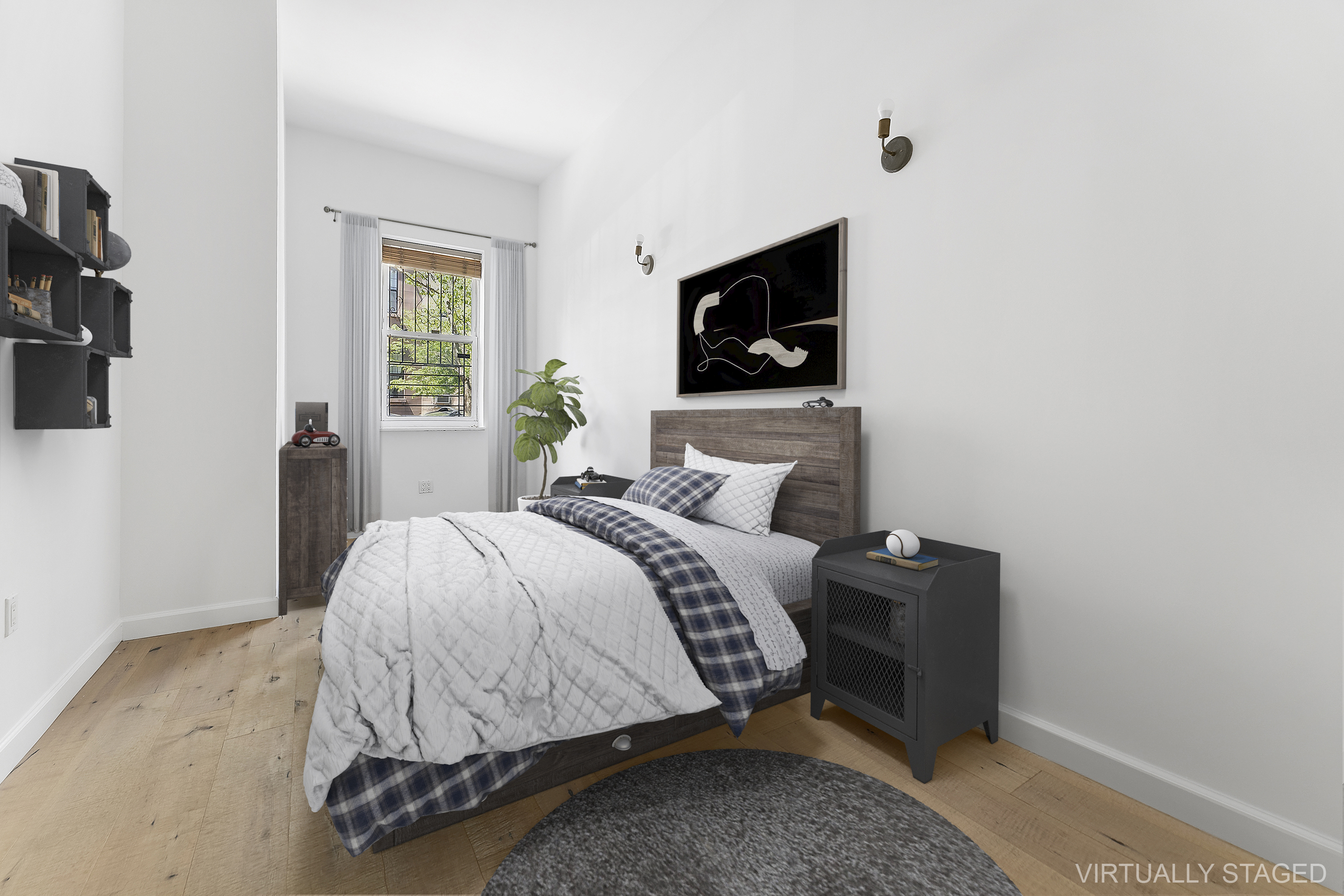 768 Hart Street, Unit 1 Brooklyn, NY 11237 - Photo 7 of 18 a bedroom with a bed and a tv on table