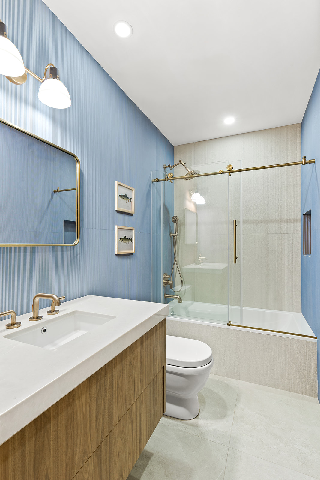 1220 Dean Street Brooklyn, NY 11216 - Photo 13 of 19 a bathroom with a sink a toilet and a large mirror