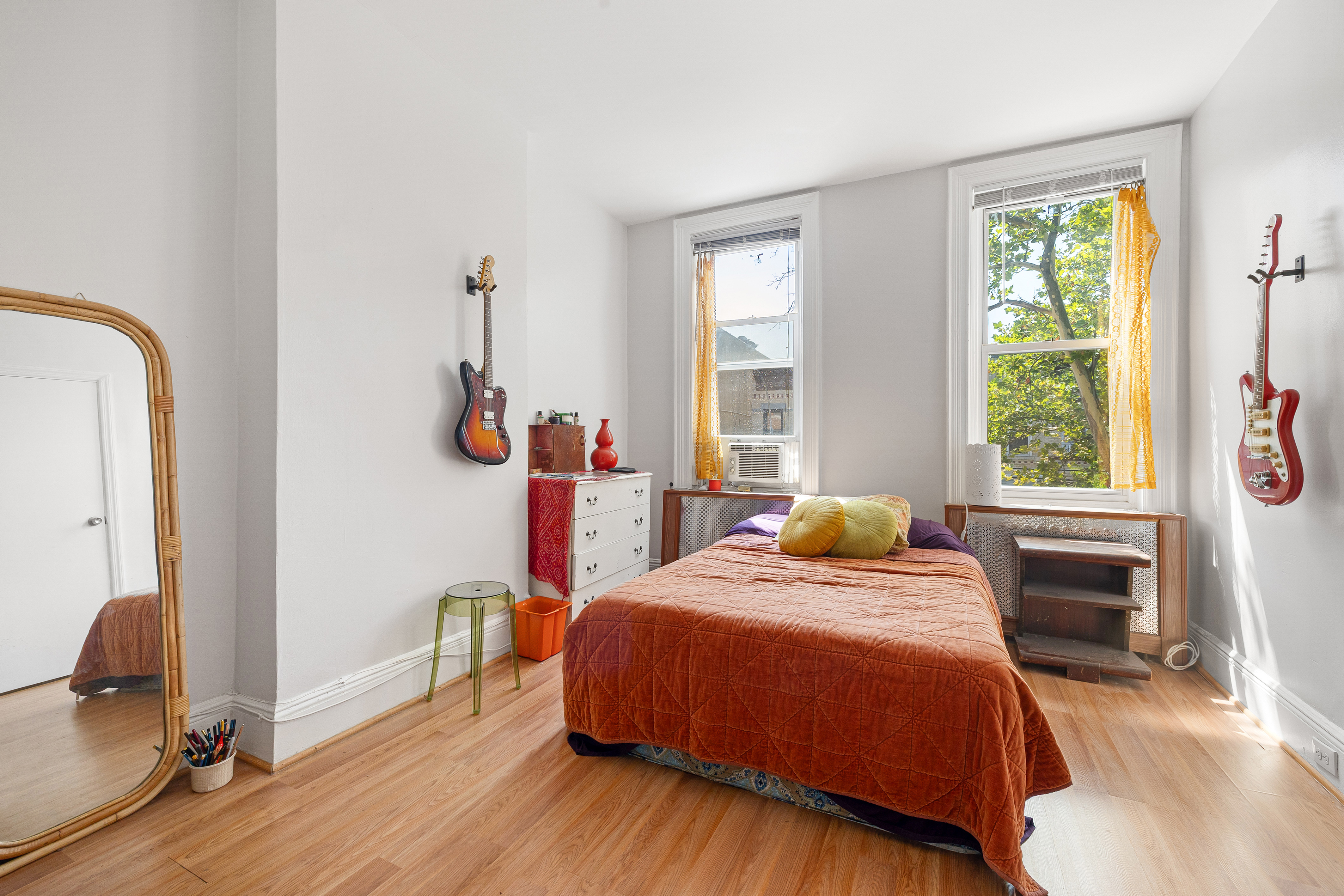 59-47 Madison Street, Unit 2 Queens, NY 11385 - Photo 7 of 12 a bedroom with a bed and a window