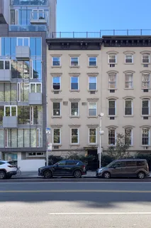 a front view of a building with a lots of windows