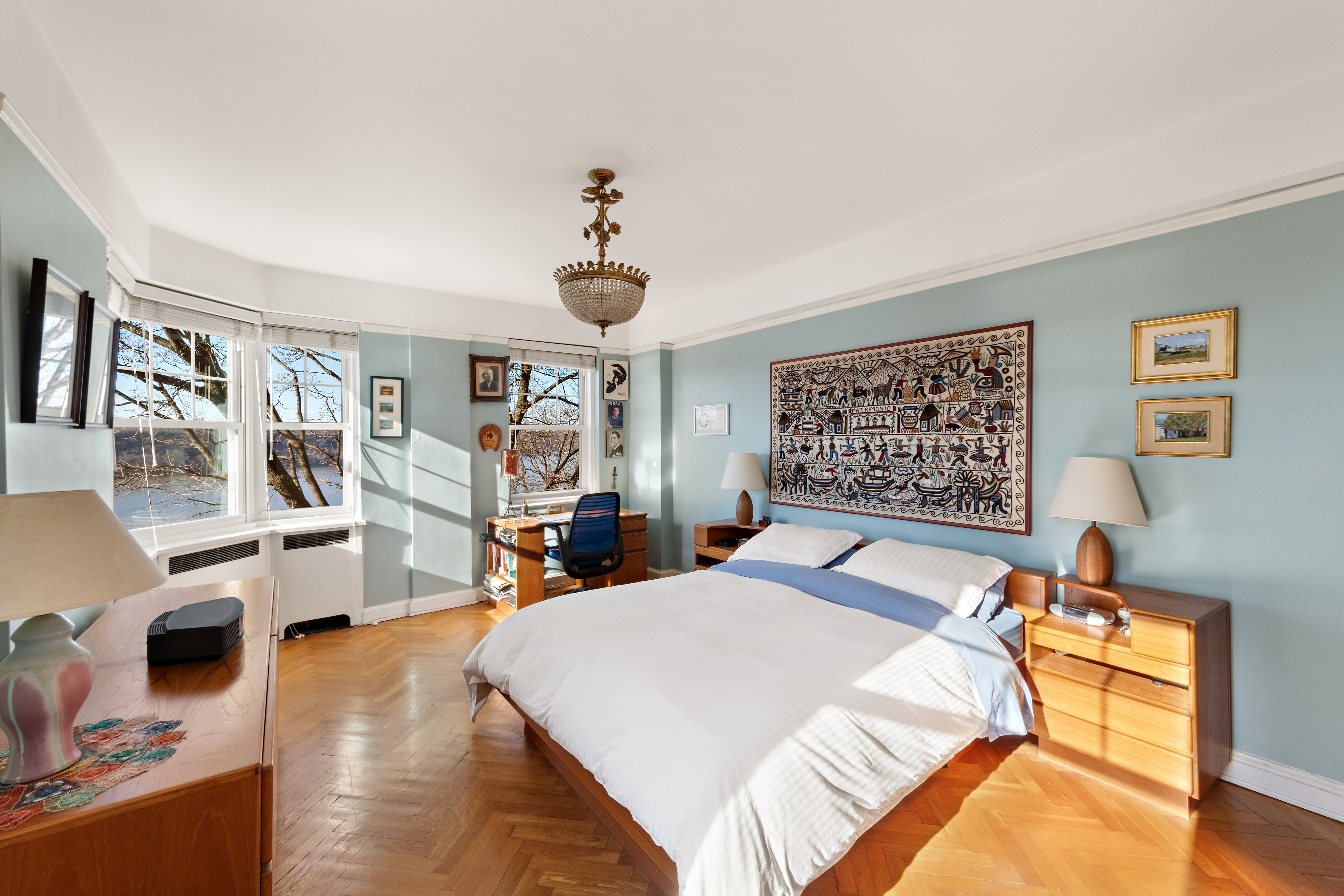 160 Cabrini Boulevard, Unit 19 Manhattan, NY 10033 - Photo 9 of 27 a bed room with a bed and a large mirror