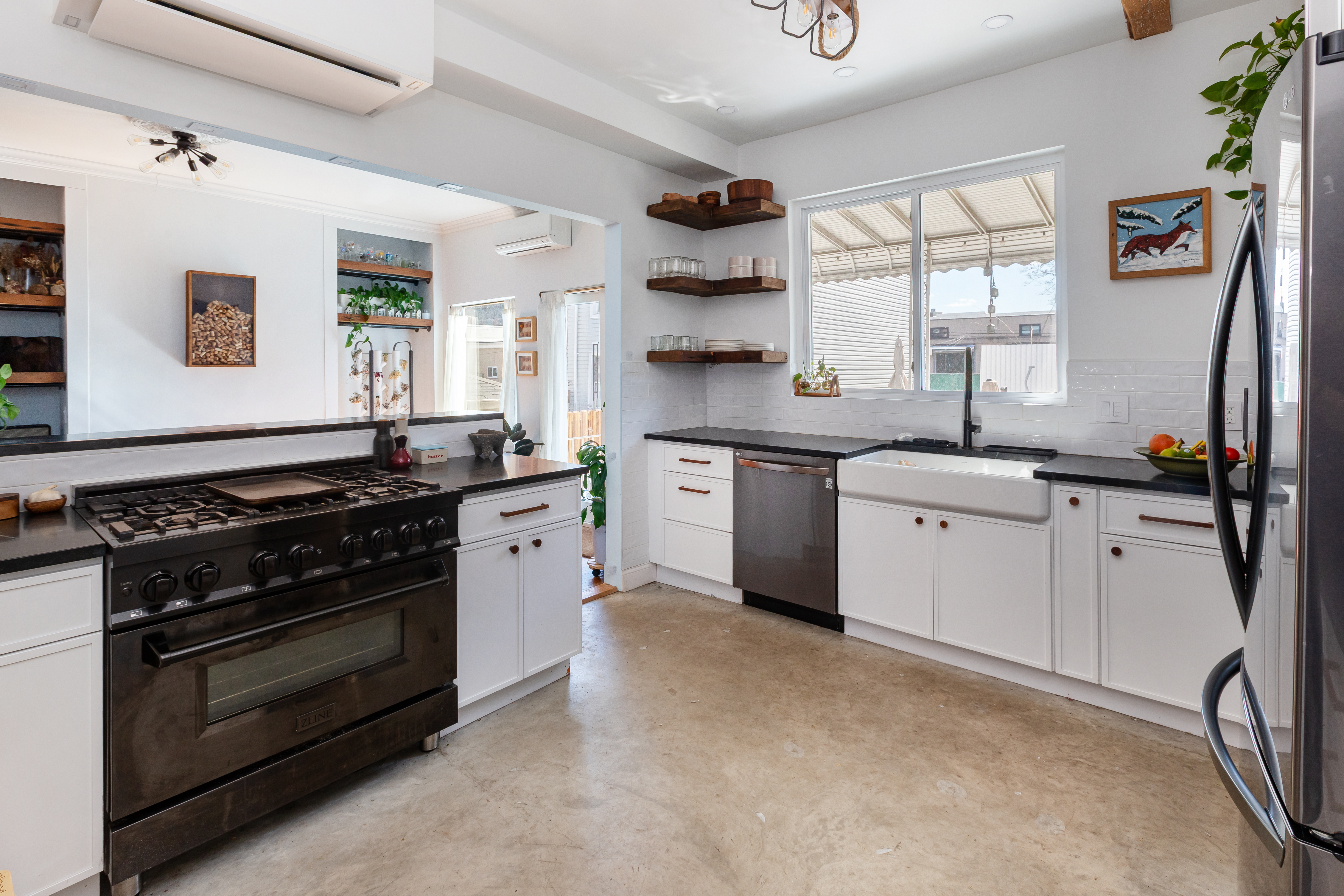 214 Eagle Street Brooklyn, NY 11222 - Photo 5 of 22 a kitchen with stainless steel appliances a stove sink and cabinets