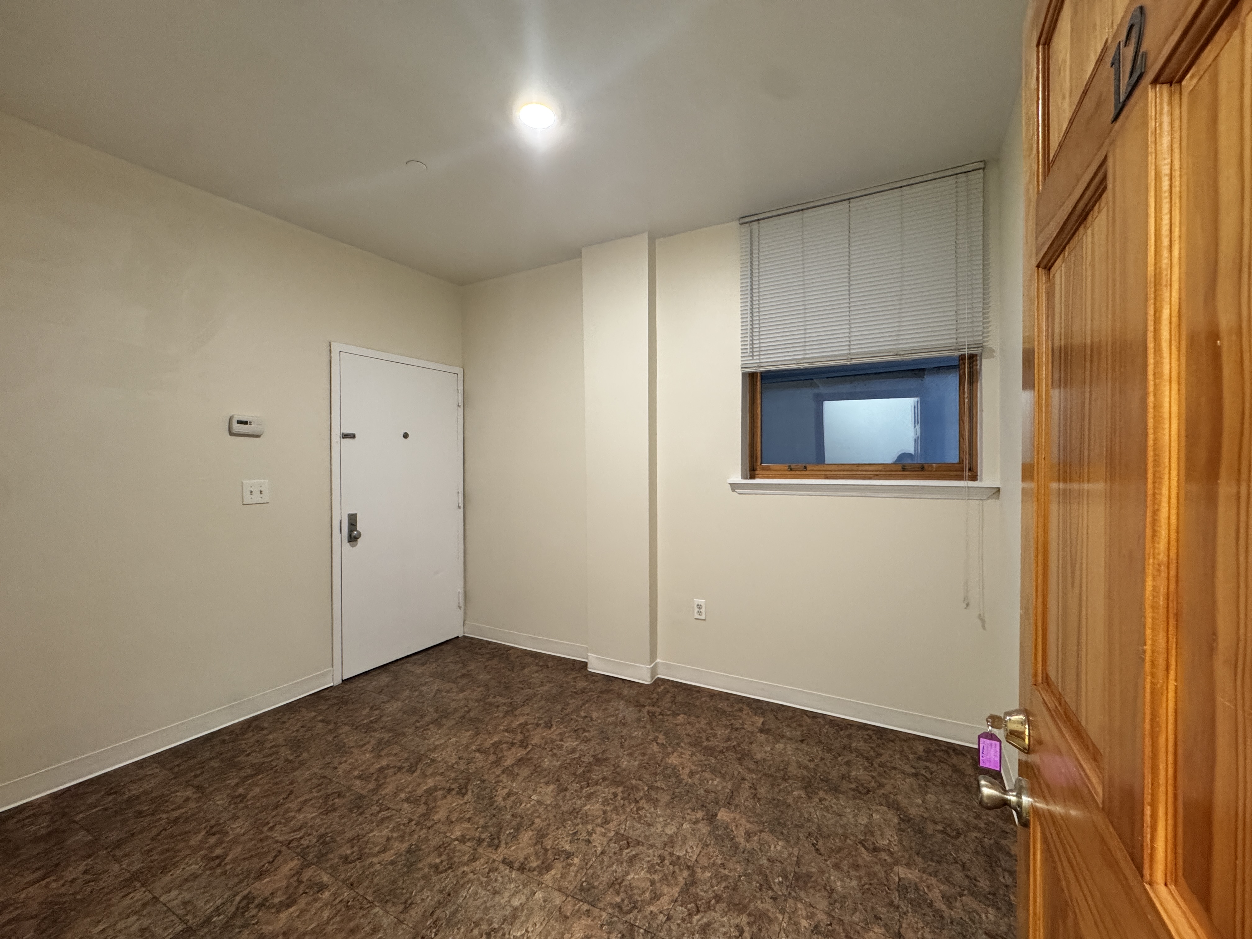 406 15th Street, Unit M1 Brooklyn, NY 11215 - Photo 16 of 19 a view of an empty room and a window