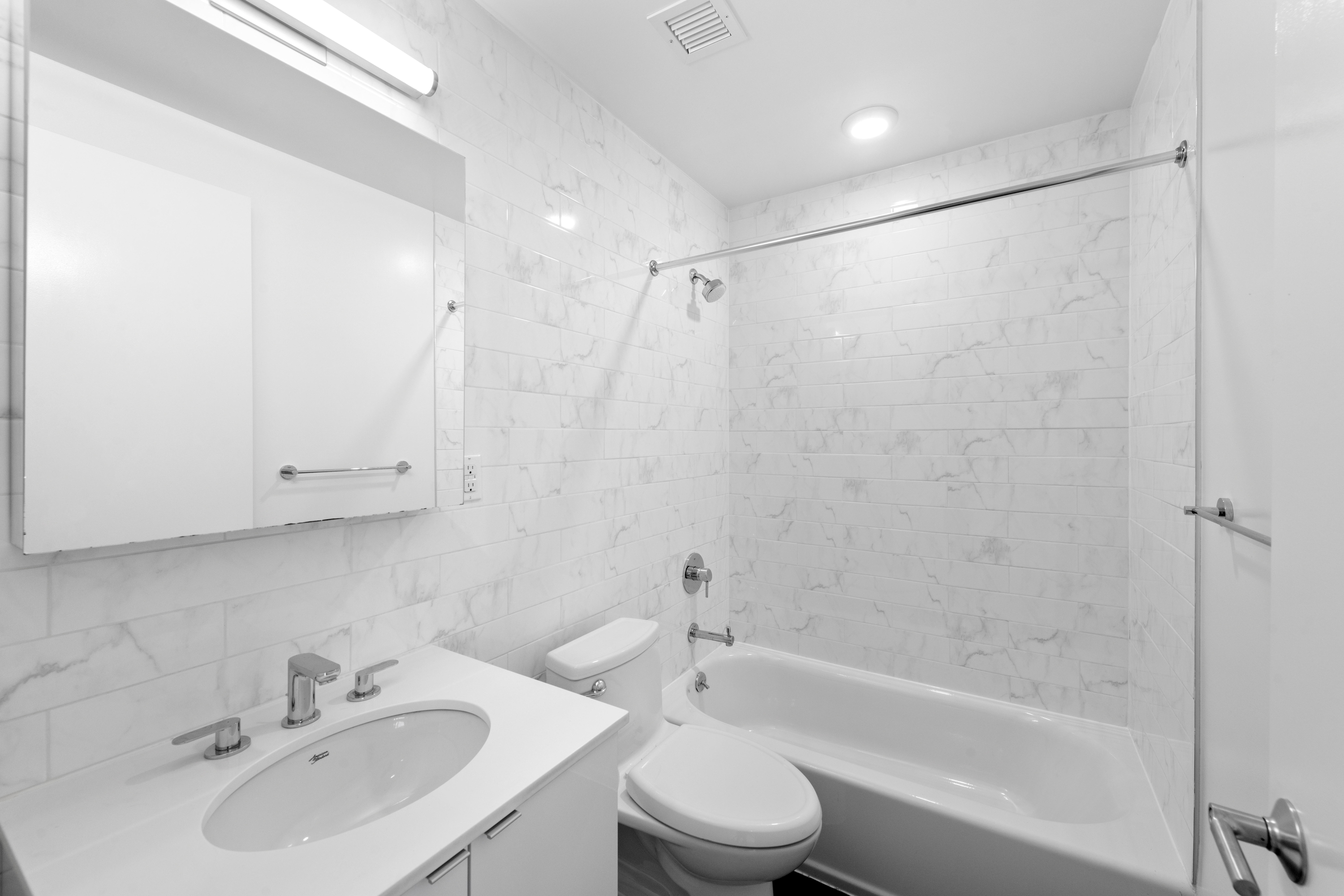 1164 Greene Avenue, Unit PHB Brooklyn, NY 11221 - Photo 6 of 16 a bathroom with a bathtub shower sink vanity and toilet
