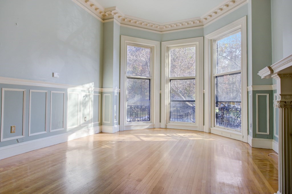 327 Commonwealth Avenue Boston, MA 02115 - Photo 14 of 26 a view of a big room with wooden floor and windows