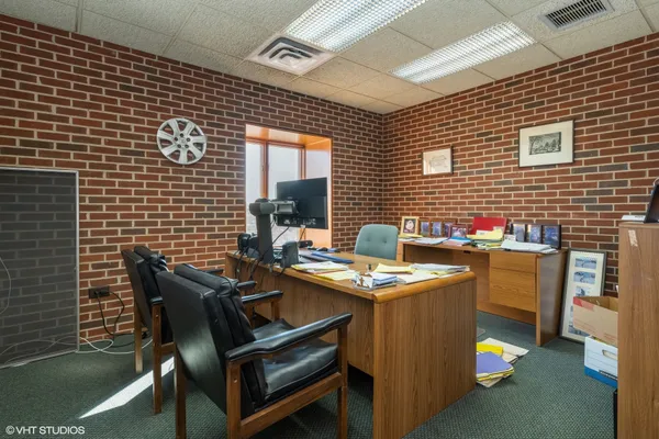 a view of a dinning table and chairs in the balcony