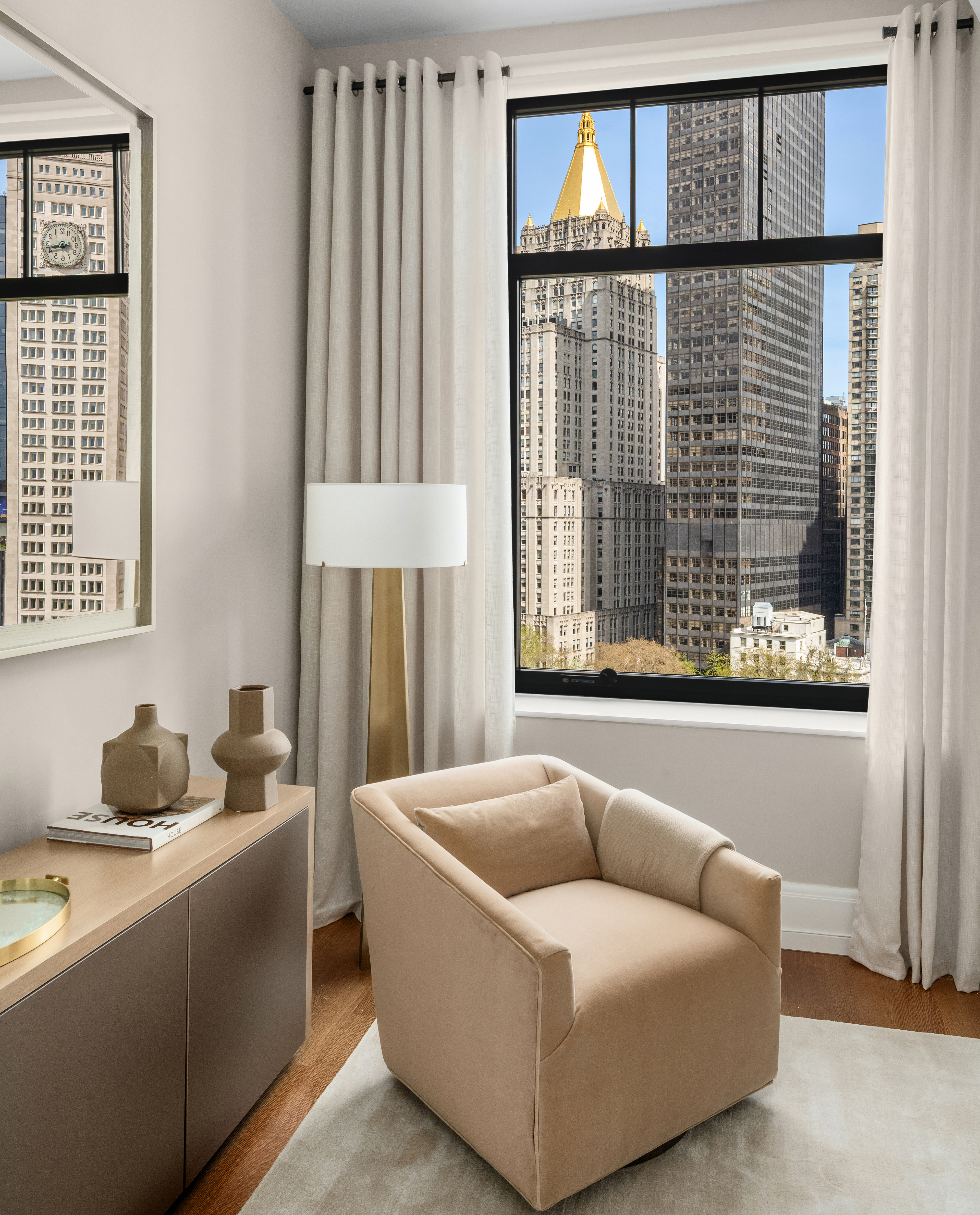 10 Madison Square West, Unit 12D Manhattan, NY 10010 - Photo 12 of 21 a living room with furniture and a window