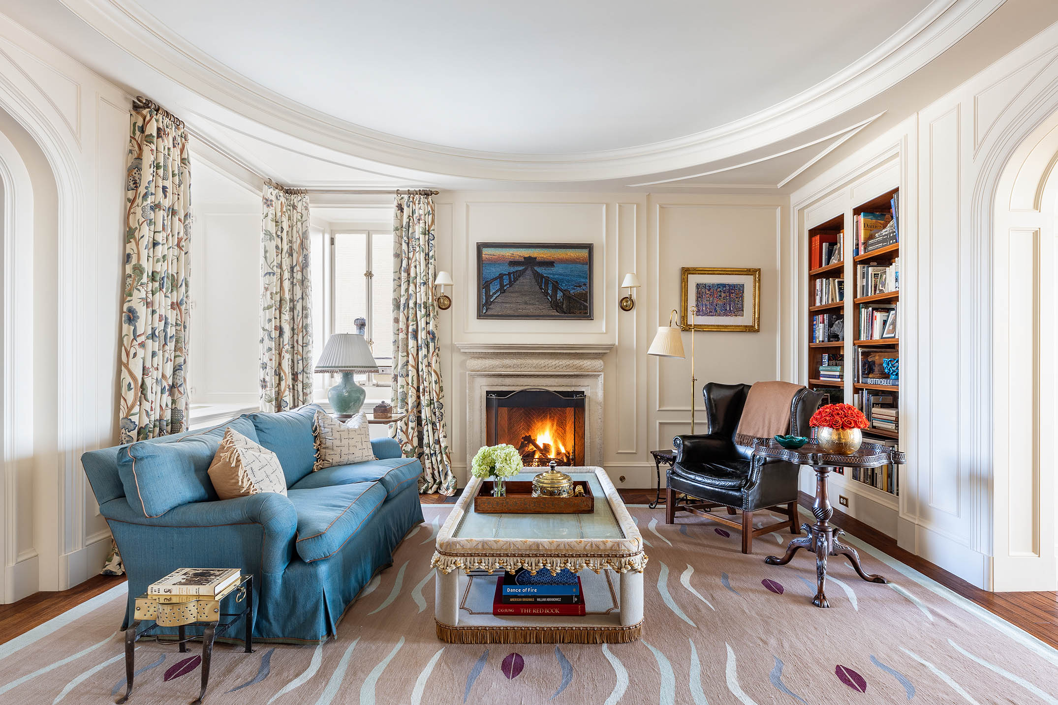 953 5th Avenue, Unit PH Manhattan, NY 10075 - Photo 3 of 27 a living room with furniture a fireplace and a flat screen tv