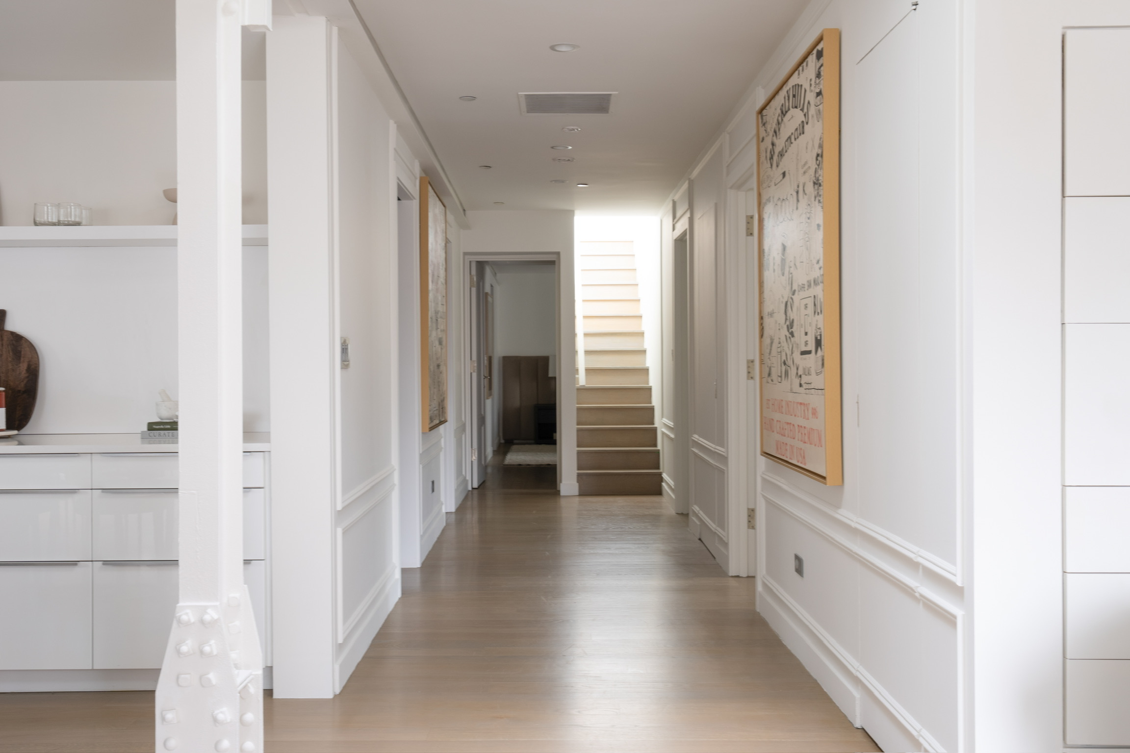 1200 Broadway, Unit PH89 Manhattan, NY 10001 - Photo 32 of 47 a view of a hallway with wooden floor and staircase