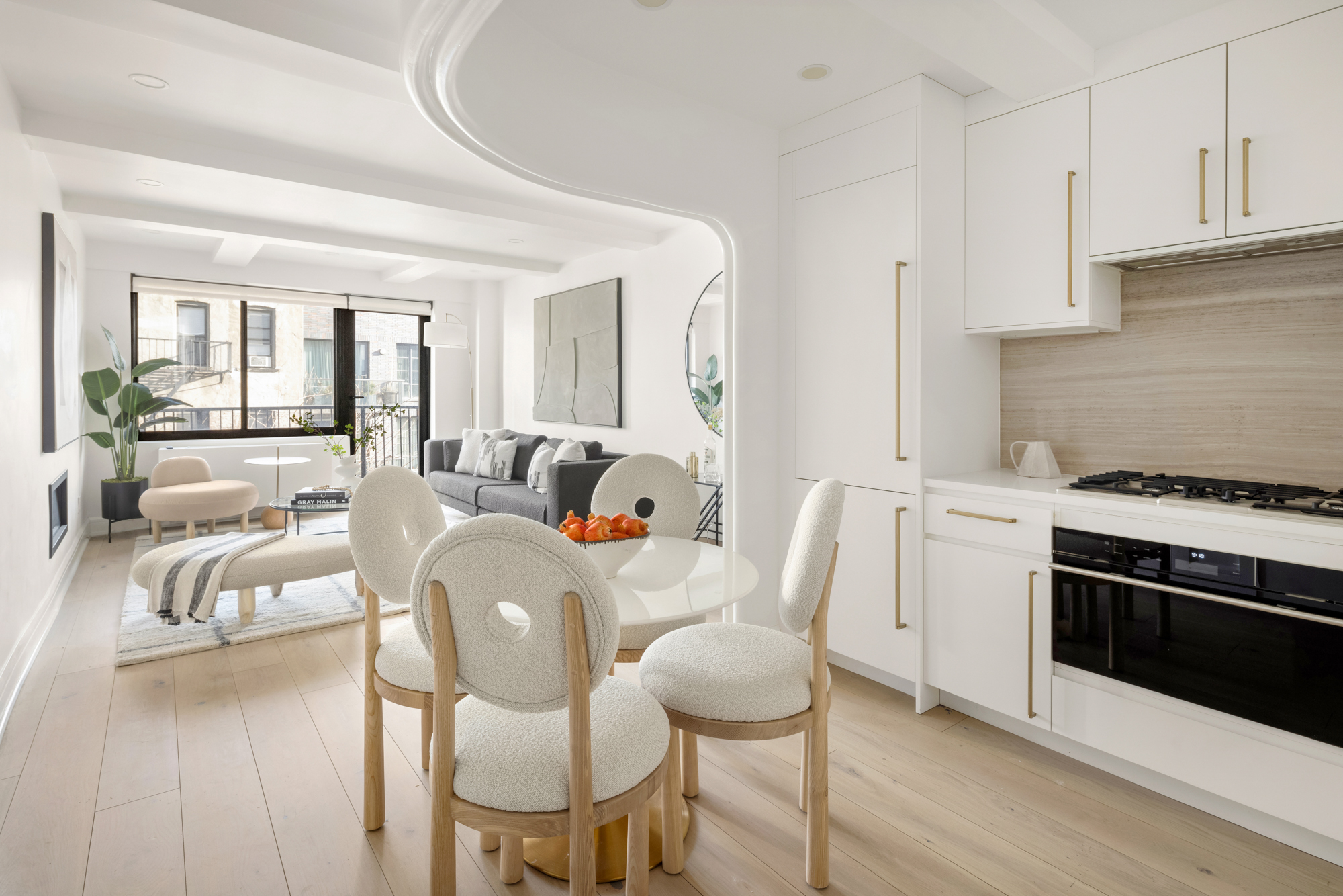 533 East 12th Street, Unit 6D Manhattan, NY 10009 - Photo 7 of 14 a living room with furniture white walls and a fireplace