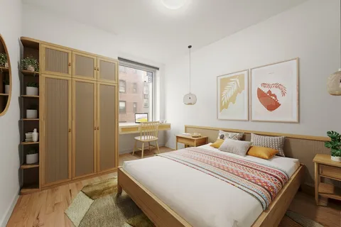 a bedroom with a bed and a painting on the wall