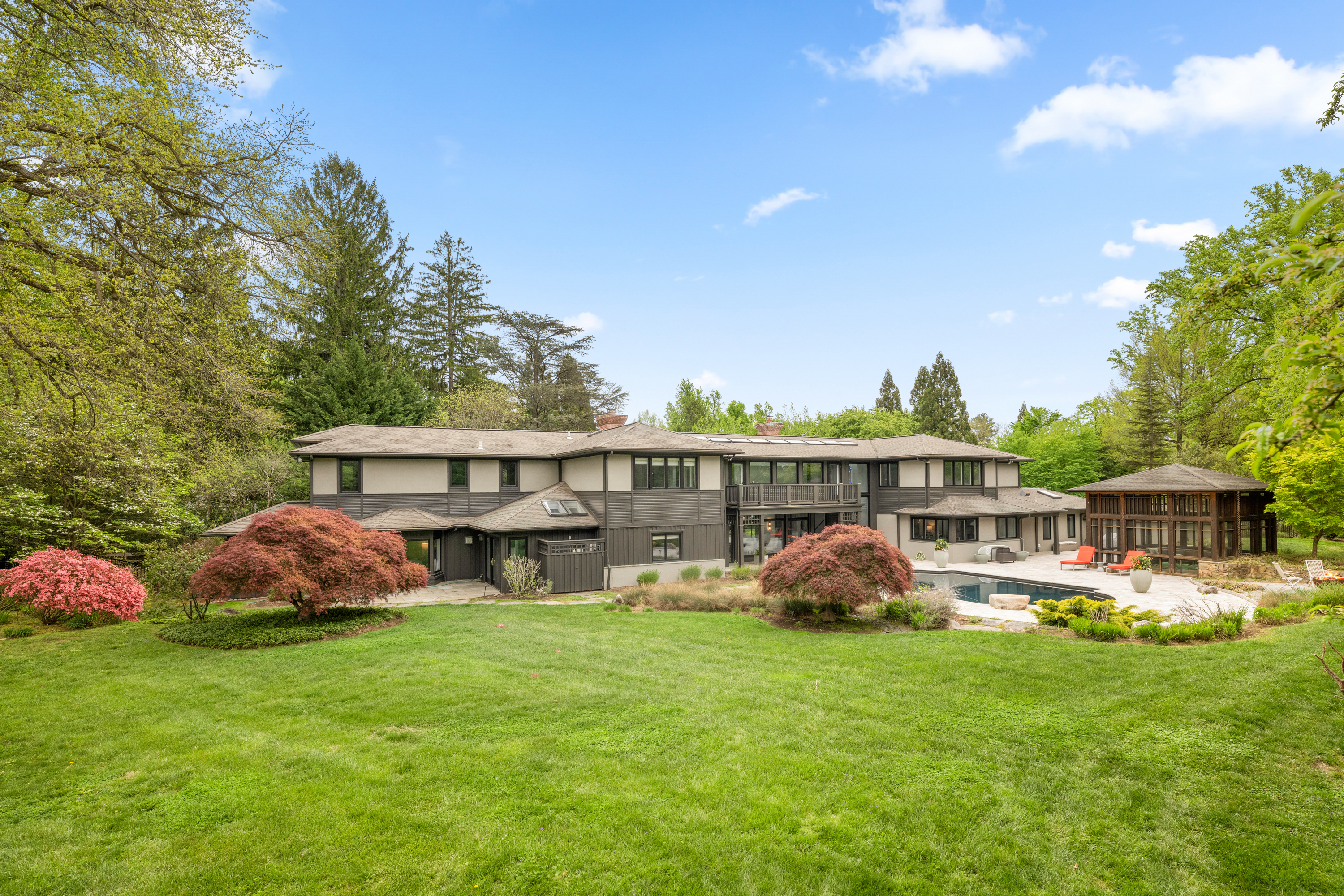 850 Lesley Road Villanova, PA 19085 - Photo 41 of 45 a front view of a house with garden and trees