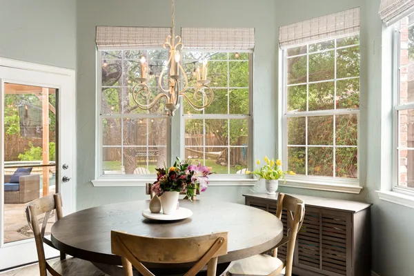 a dining room with furniture and window