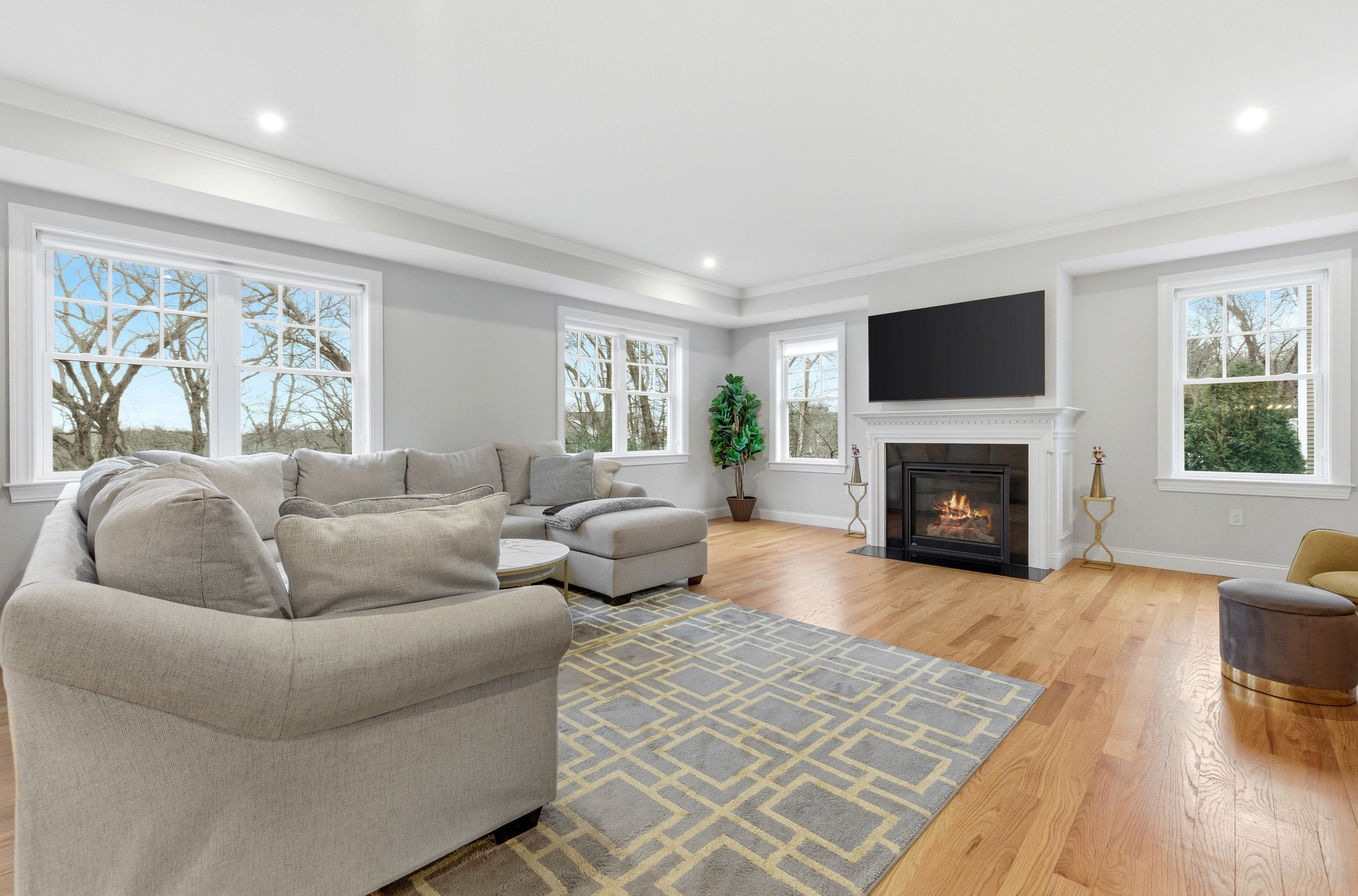 41 Peach Orchard Road Burlington, MA 01803 - Photo 4 of 15 a living room with furniture flat screen tv and a fireplace