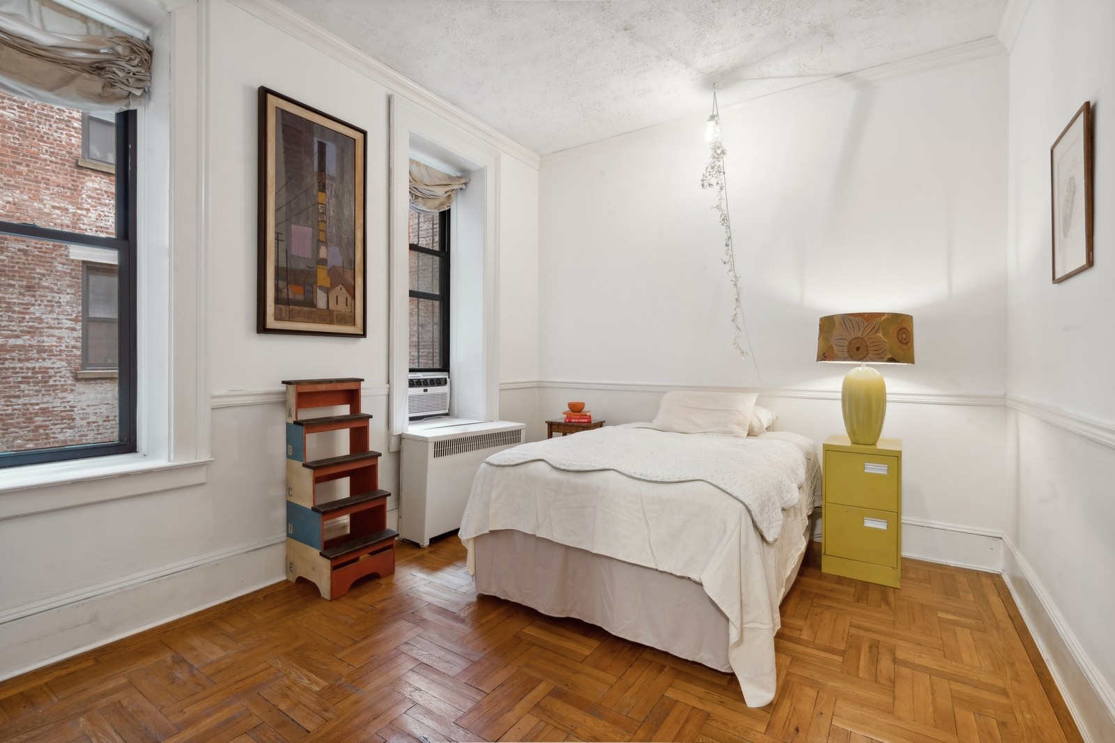 401 West End Avenue, Unit 1G Manhattan, NY 10024 - Photo 7 of 9 a bedroom with a bed and a window