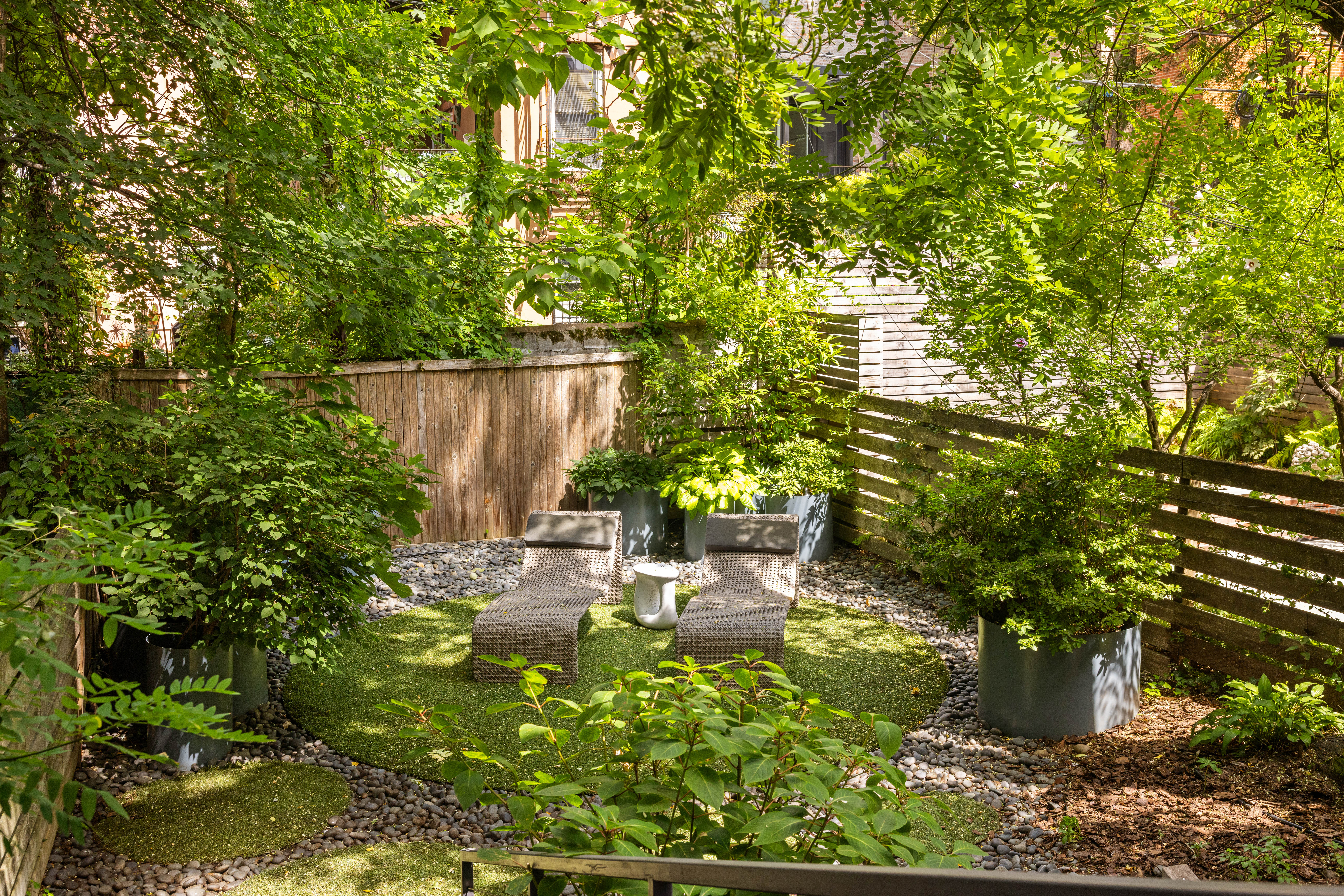229 Dean Street Brooklyn, NY 11217 - Photo 10 of 23 a backyard of a house with table and chairs
