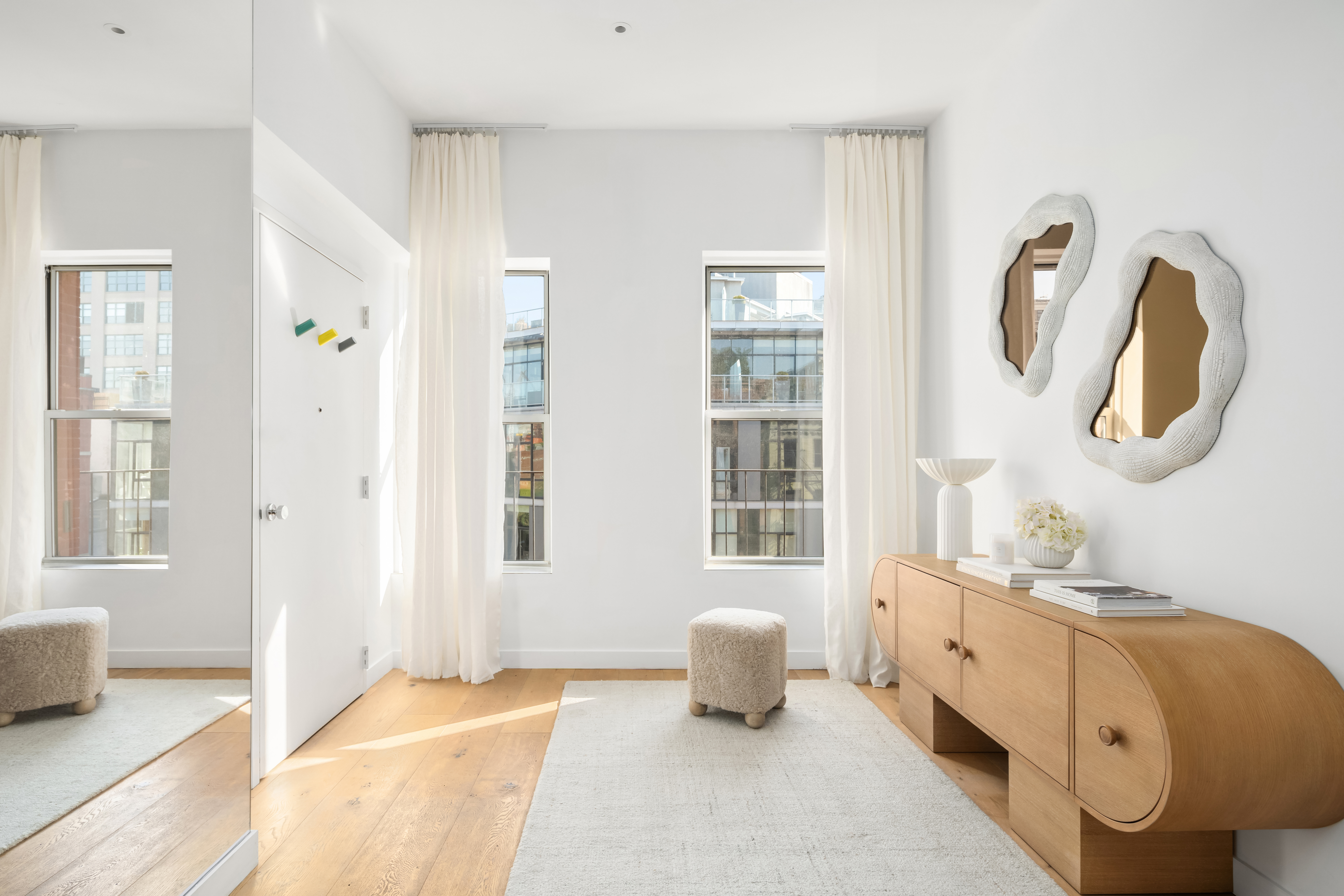 472 Greenwich Street, Unit PH Manhattan, NY 10013 - Photo 6 of 13 a spacious bedroom with a bed a dresser and a window