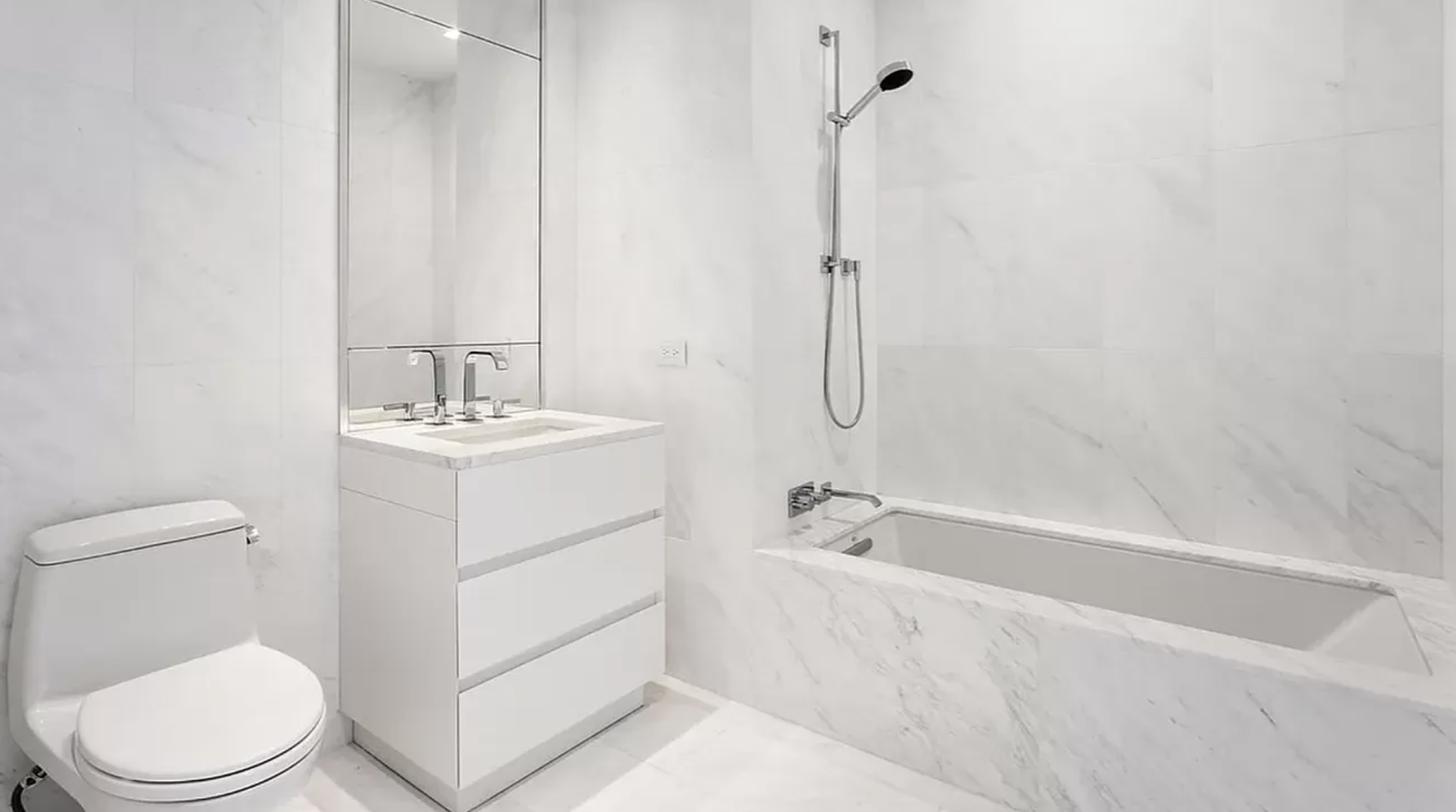 111 Murray Street, Unit 43W Manhattan, NY 10007 - Photo 10 of 32 a bathroom with a sink a toilet and shower