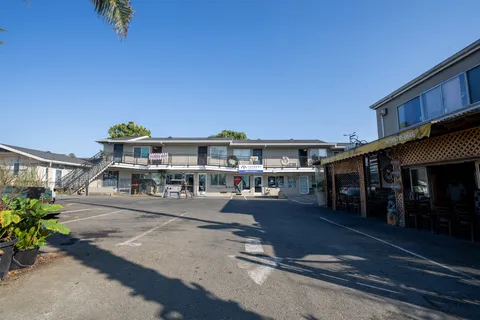 a view of multiple houses with a street