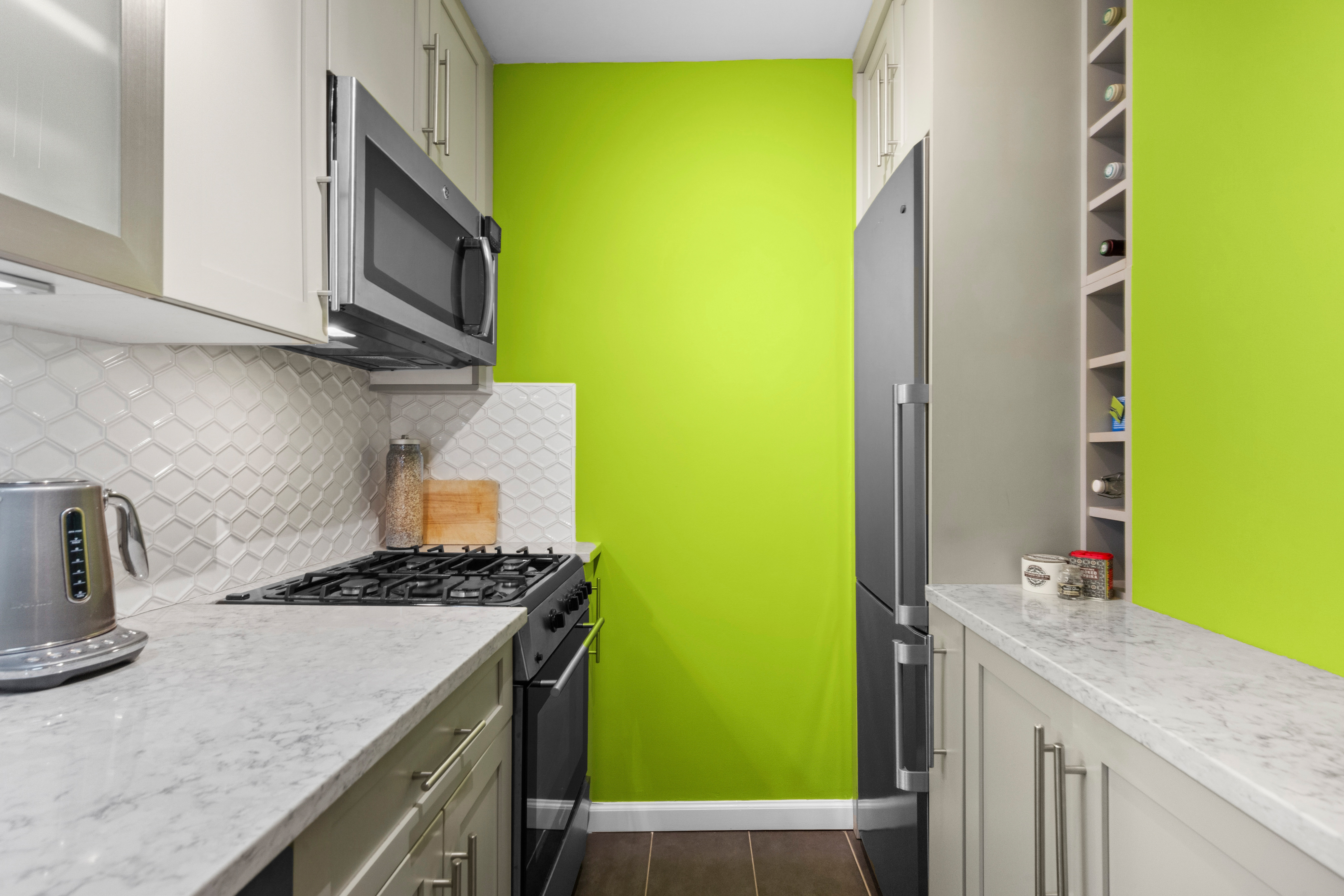 333 East 79th Street, Unit 5P Manhattan, NY 10075 - Photo 4 of 13 a kitchen with a sink and a stove