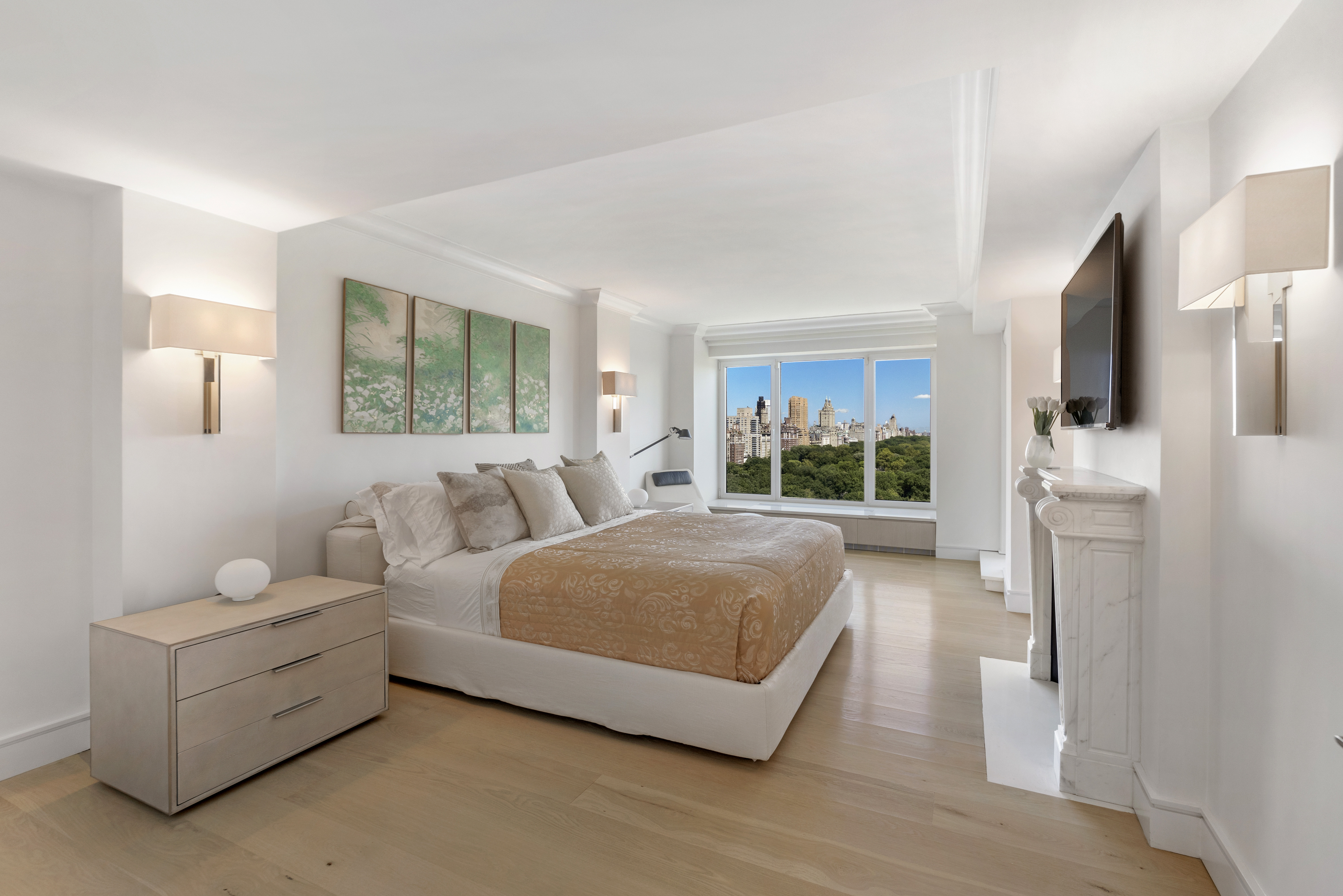 200 Central Park South, Unit 20DEF Manhattan, NY 10019 - Photo 9 of 16 a living room with furniture and a flat screen tv