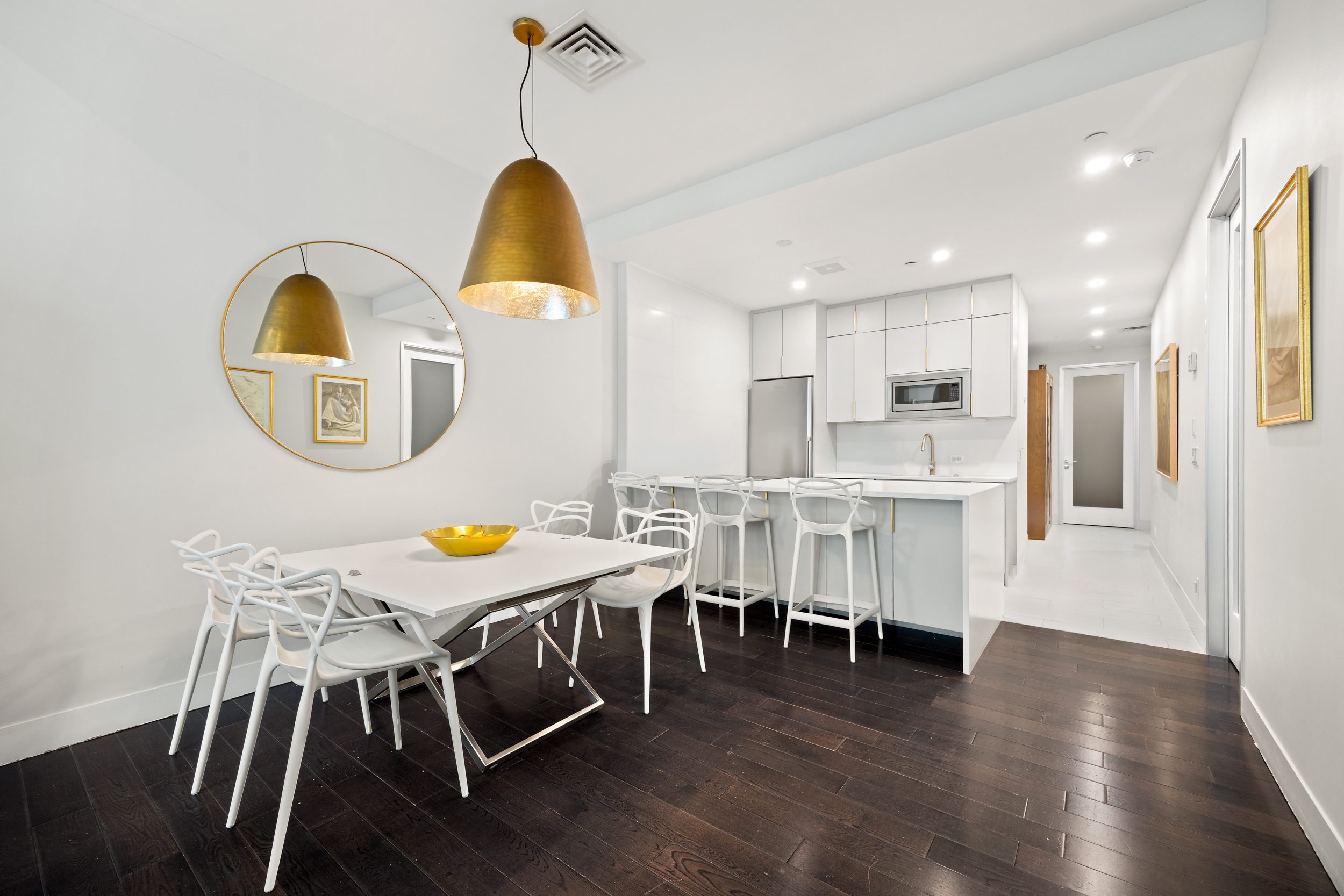 111 Fulton Street, Unit 824 Manhattan, NY 10038 - Photo 4 of 35 a view of a dining room with furniture and wooden floor