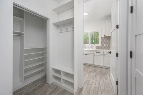 a spacious bedroom with a bed and a window