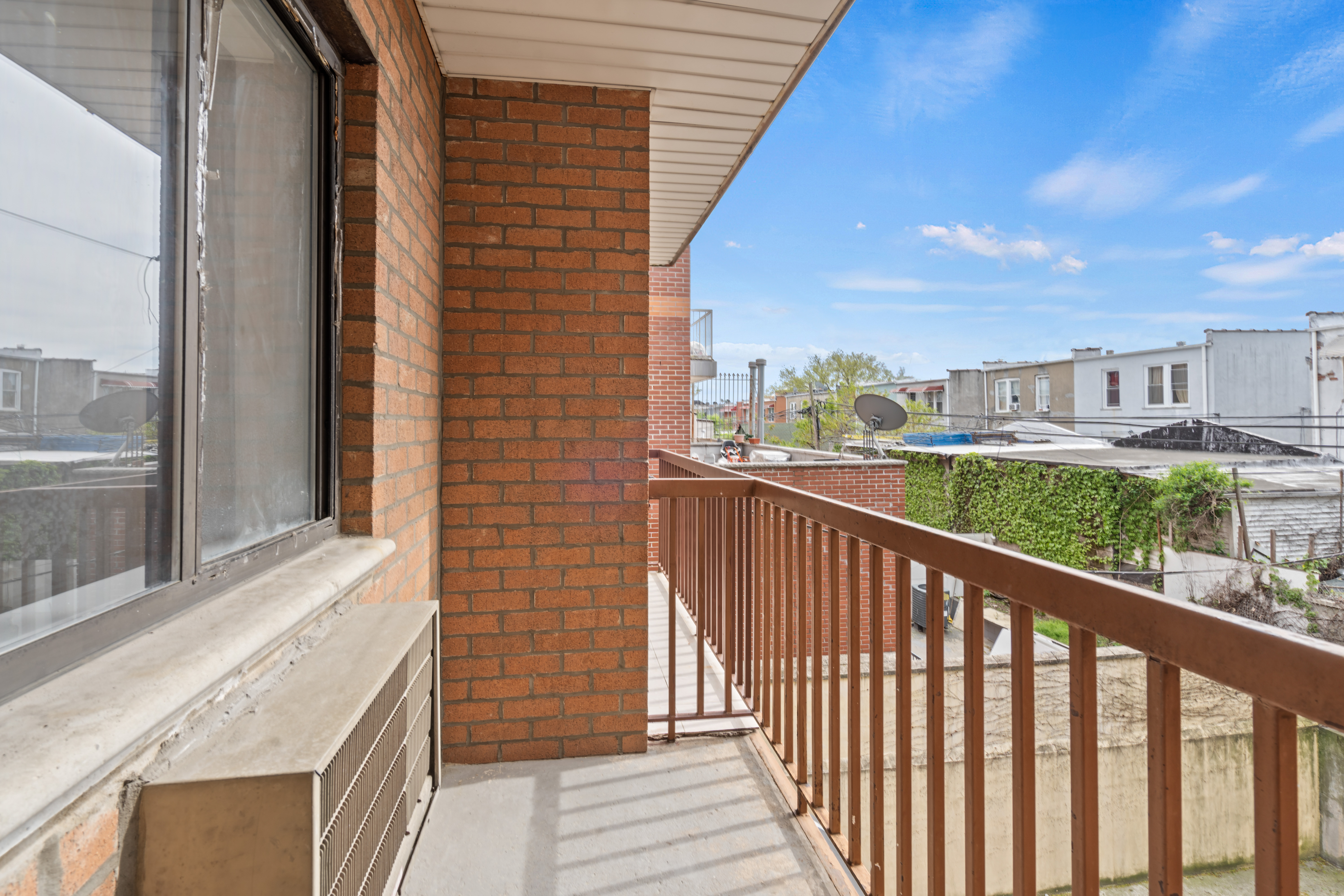 37-30 103rd Street, Unit 2E Queens, NY 11368 - Photo 6 of 8 a balcony with a city view