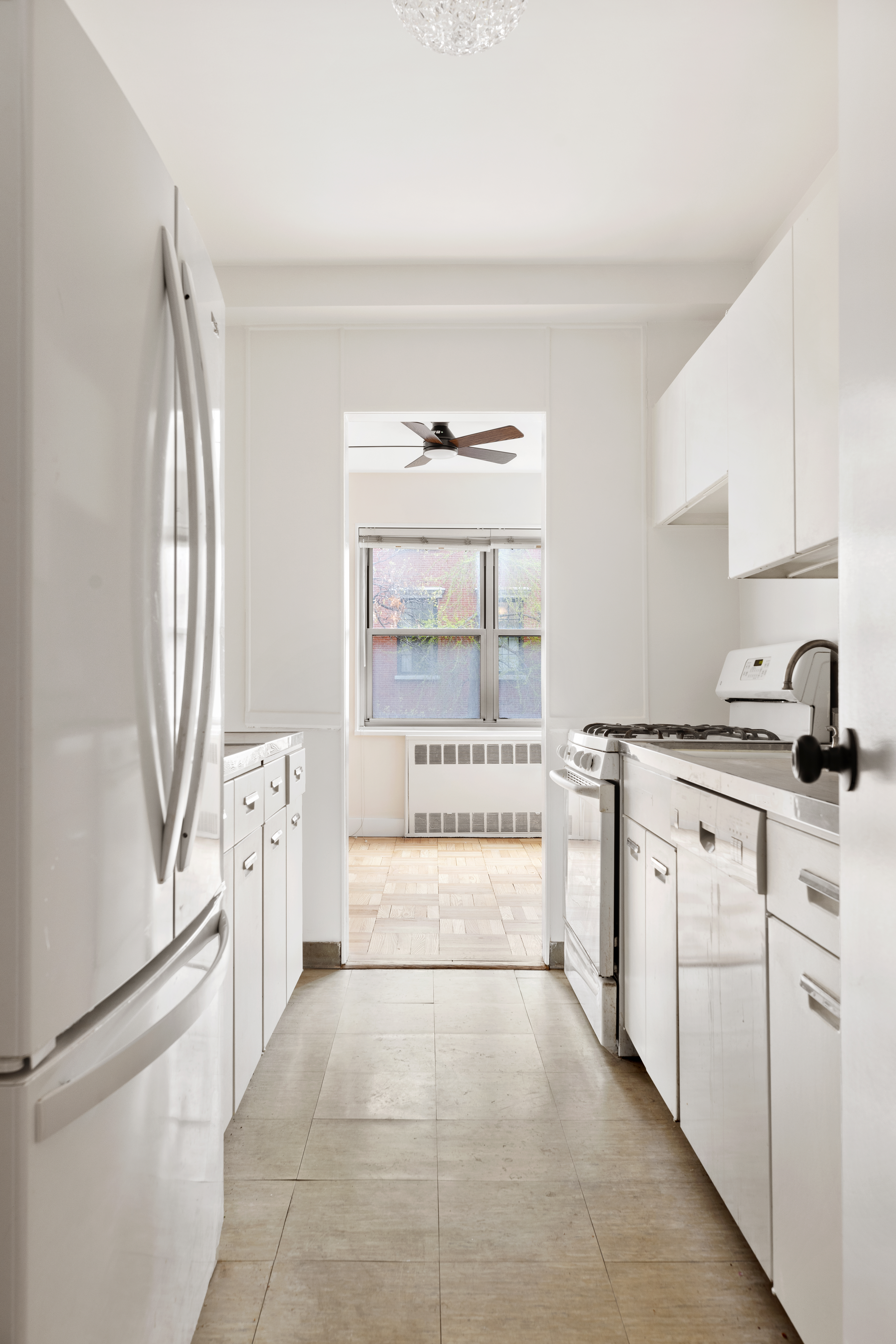 11 5th Avenue, Unit 3T Manhattan, NY 10003 - Photo 3 of 13 a room with a bed and a large window