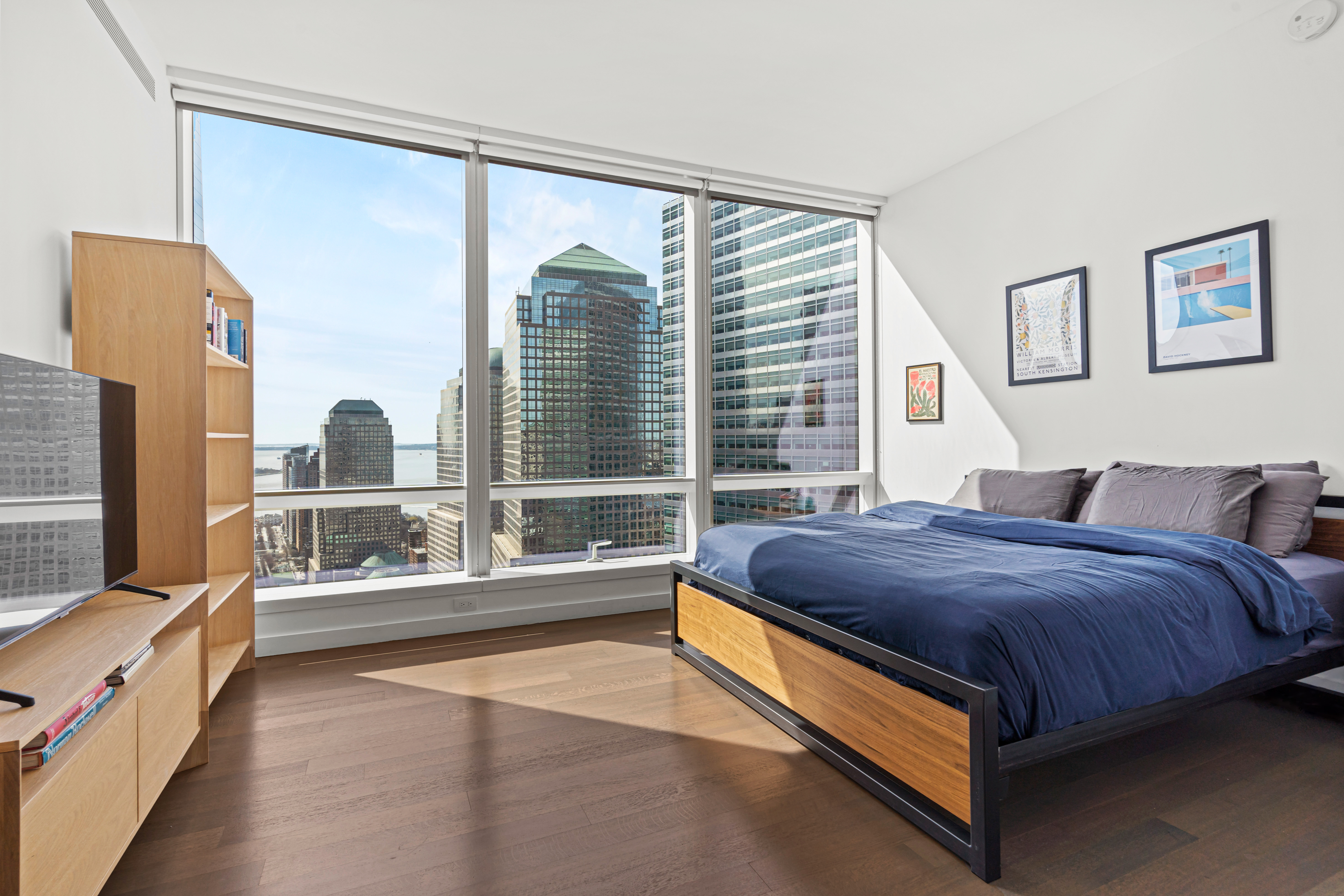 111 Murray Street, Unit 43B Manhattan, NY 10007 - Photo 6 of 17 a spacious bedroom with a large bed and a large window