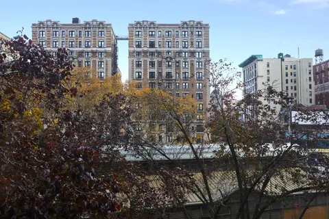 a view of a city with tall buildings
