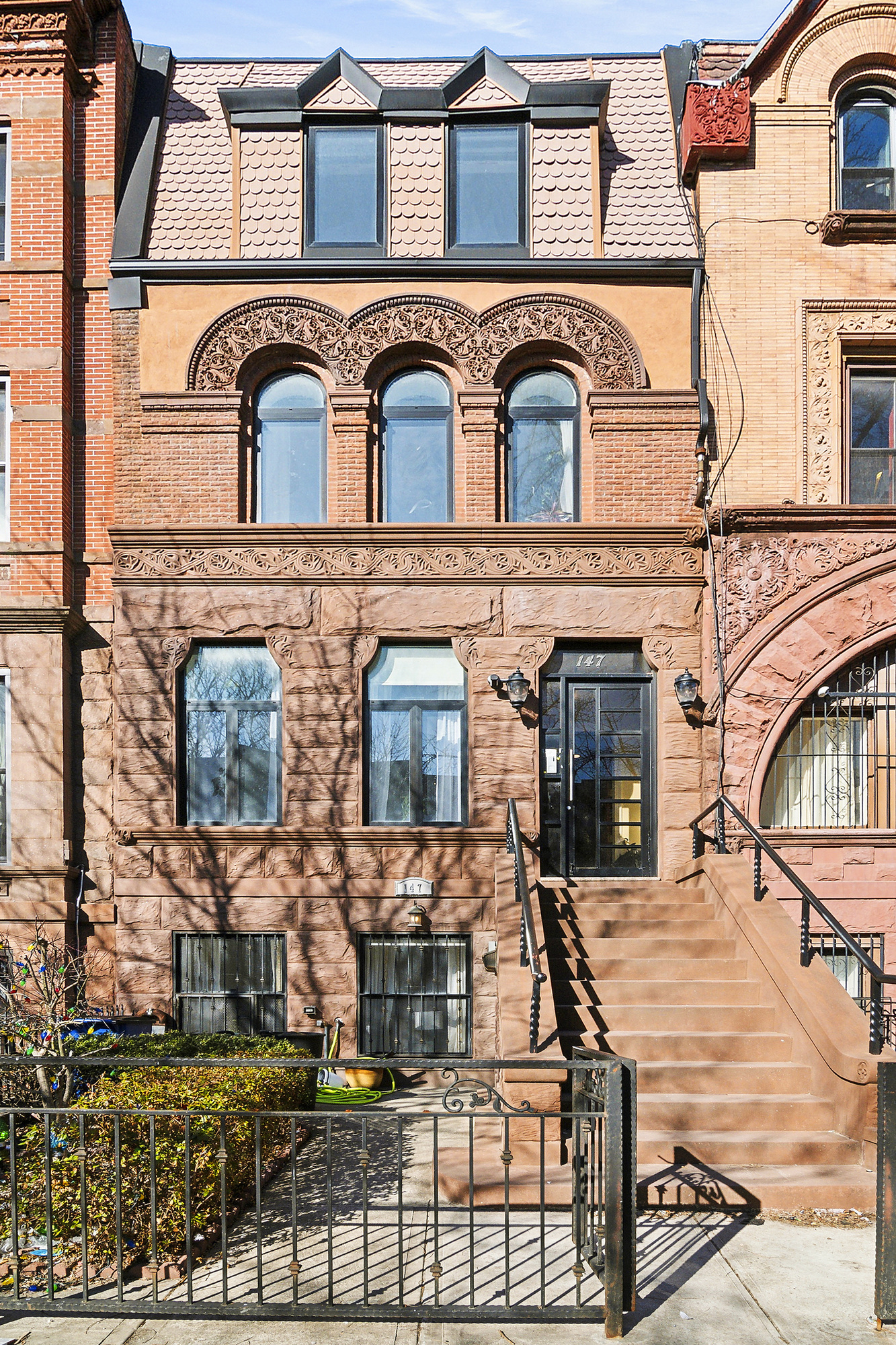 147 Herkimer Street Brooklyn, NY 11216 - Photo 23 of 25 a front view of a house with large windows