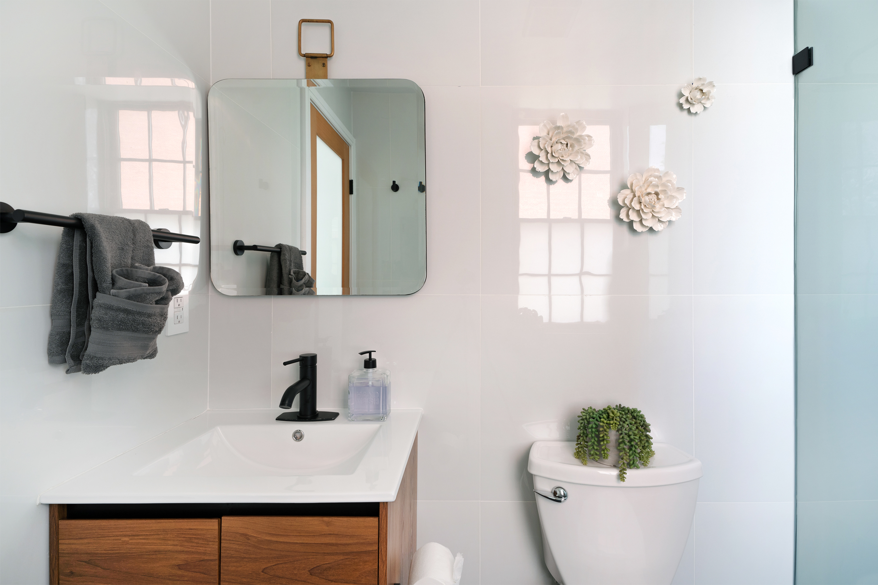 334 Plymouth Street Brooklyn, NY 11201 - Photo 19 of 32 a bathroom with a sink toilet and mirror