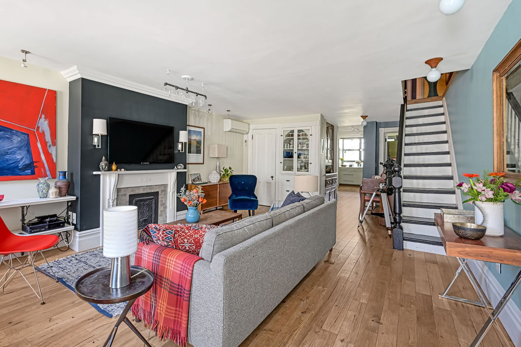 315 15th Street Brooklyn, NY 11215 - Photo 2 of 25 a living room with furniture and a flat screen tv