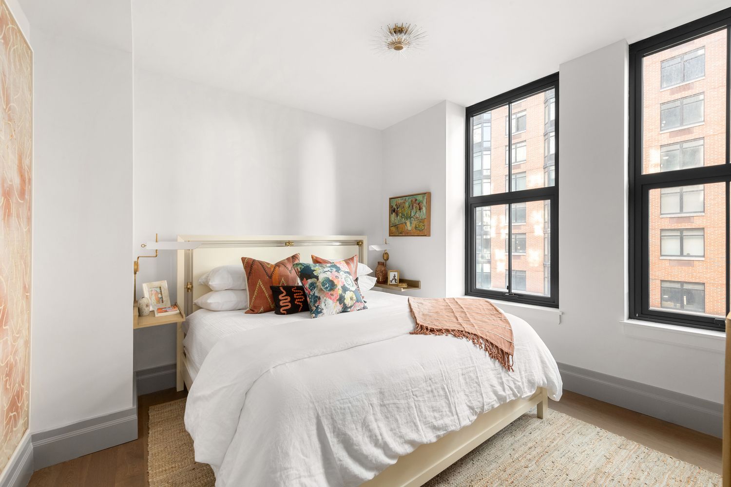 76 Schermerhorn Street, Unit 8E Brooklyn, NY 11201 - Photo 5 of 8 a large bed sitting in a bedroom next to a window