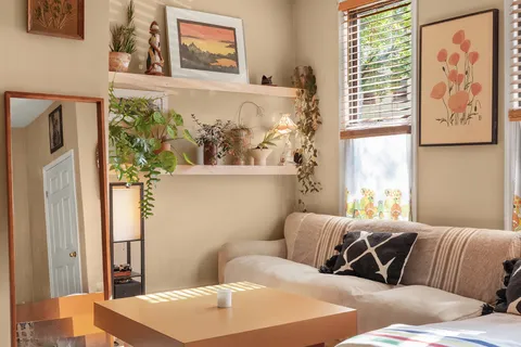 a bedroom with furniture and a window