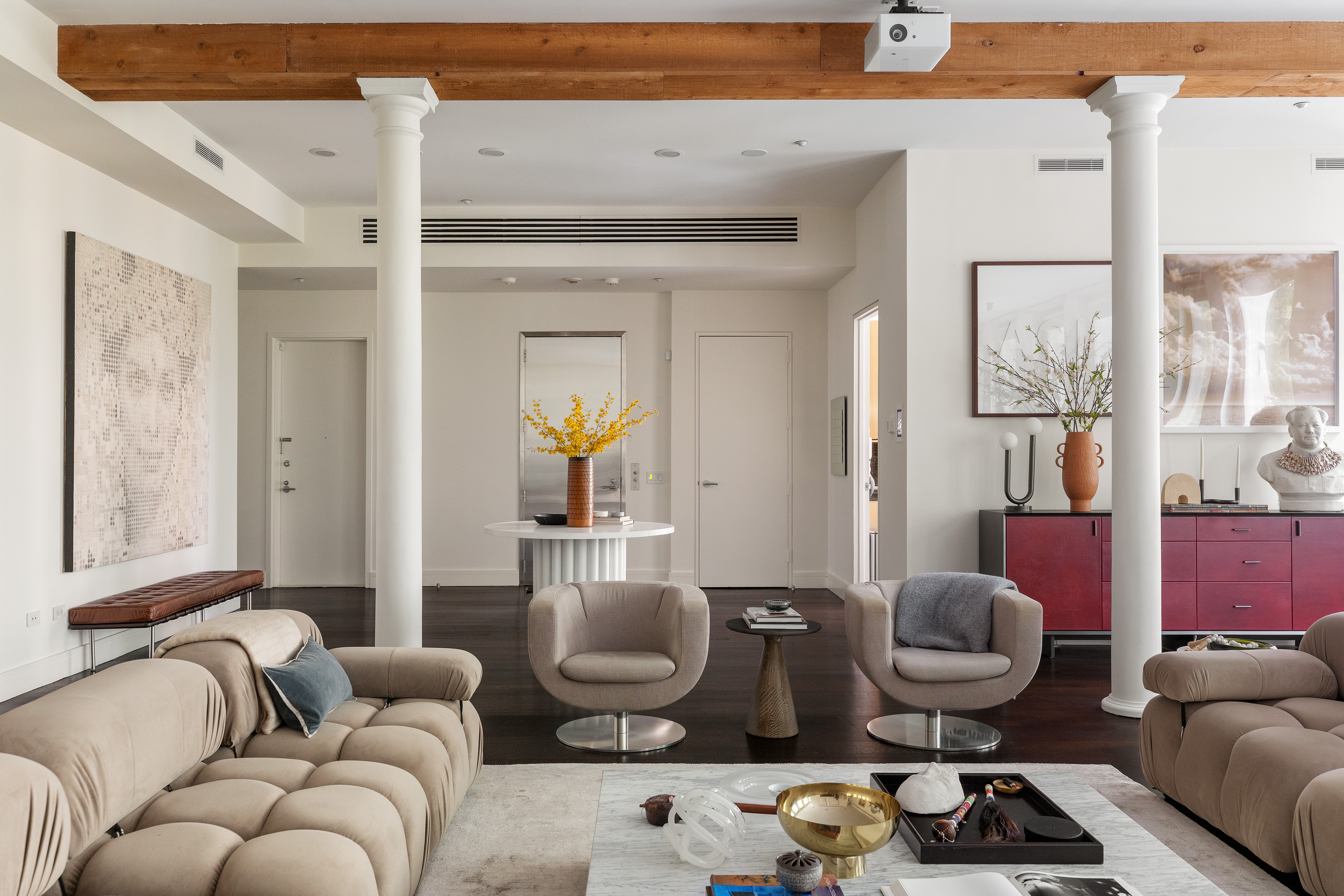 388 West Broadway, Unit 2 Manhattan, NY 10012 - Photo 2 of 27 a living room with furniture and a potted plant