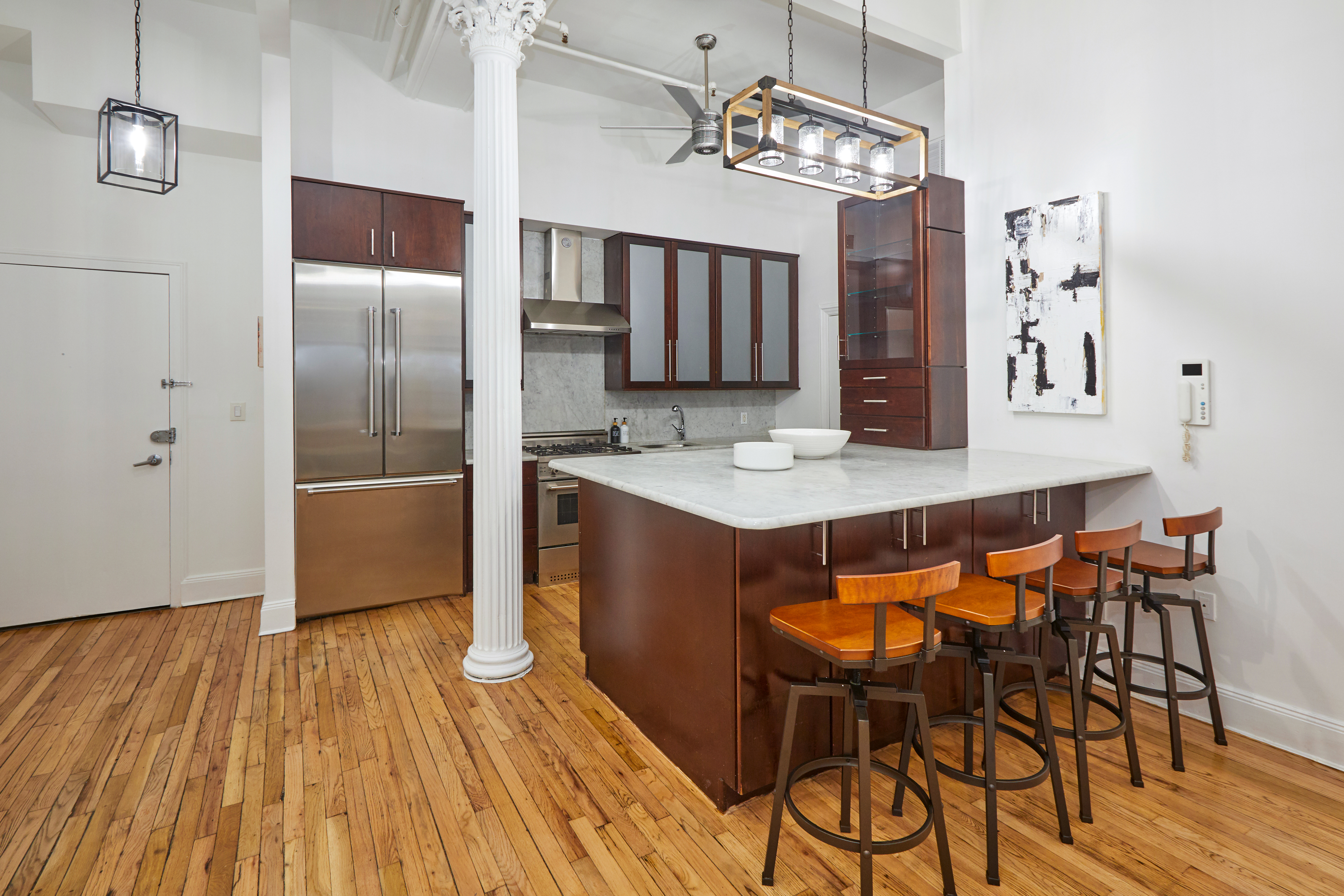 80 Leonard Street, Unit 3G Manhattan, NY 10013 - Photo 14 of 30 a view of a dining room with furniture and wooden floor