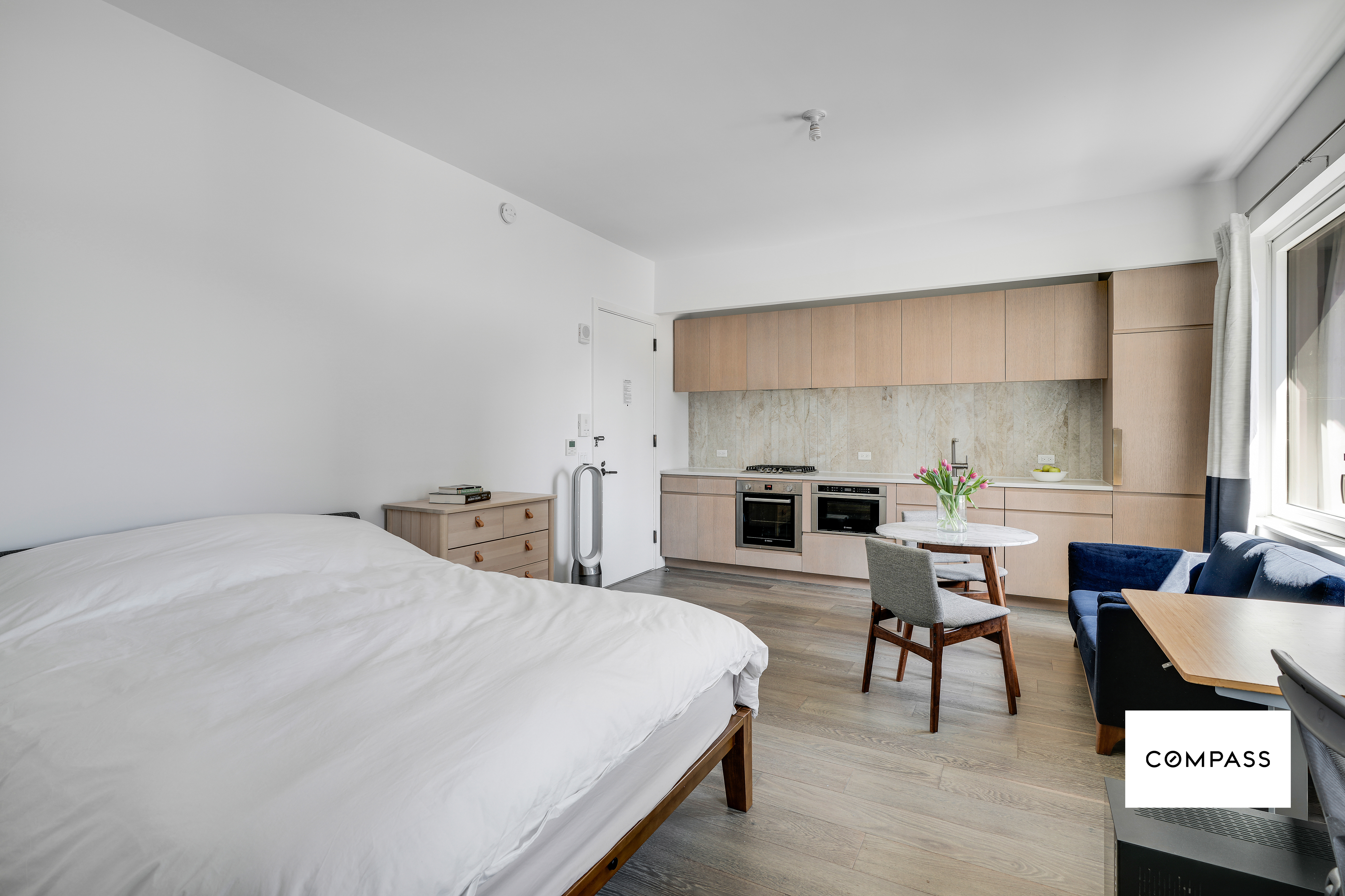 10 Nevins Street, Unit 14E Brooklyn, NY 11217 - Photo 3 of 11 a living room with furniture and view of kitchen