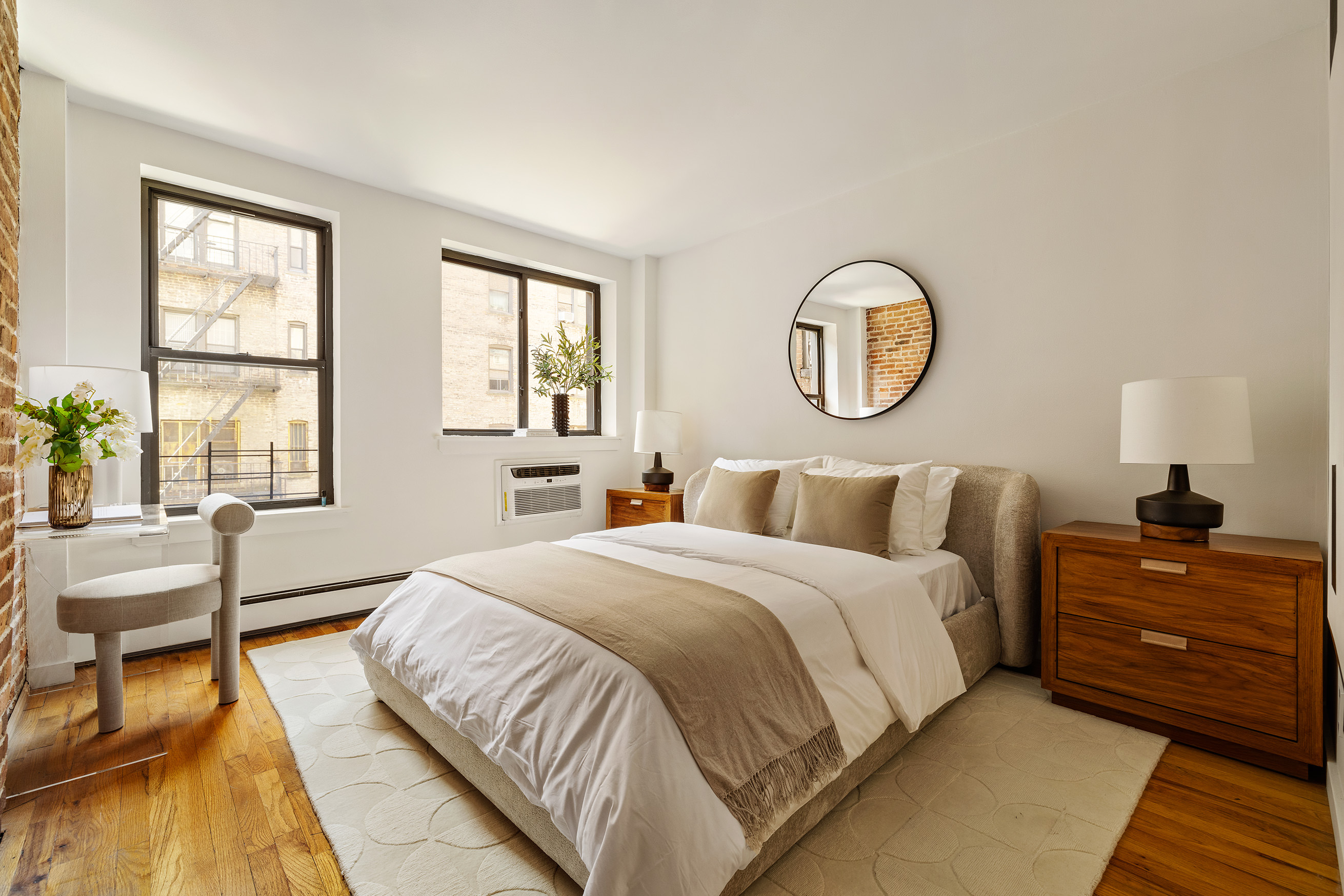 410 West 25th Street, Unit 2B Manhattan, NY 10001 - Photo 5 of 9 a bedroom with a bed and window