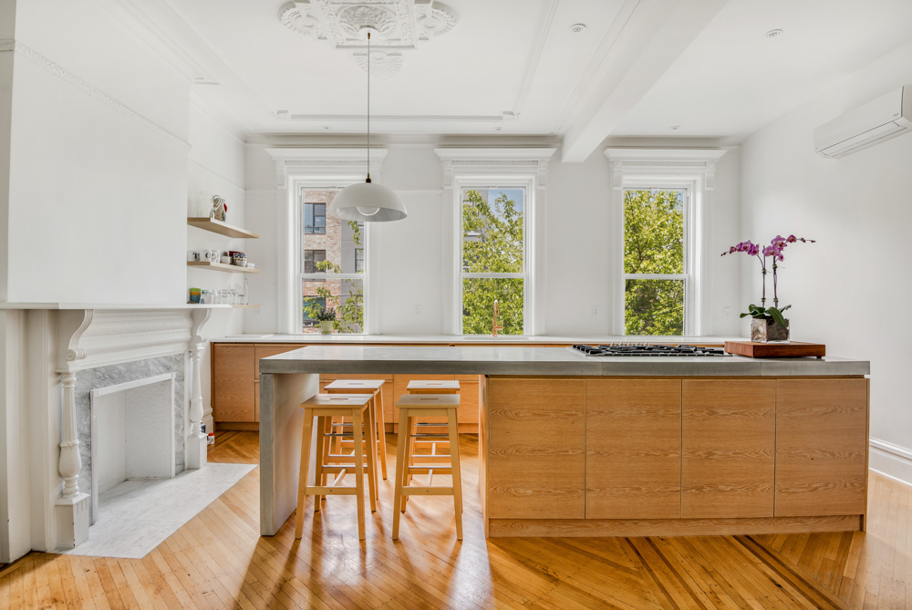 611 Macon Street Brooklyn, NY 11233 - Photo 1 of 12 a view of kitchen with furniture window and wooden floor