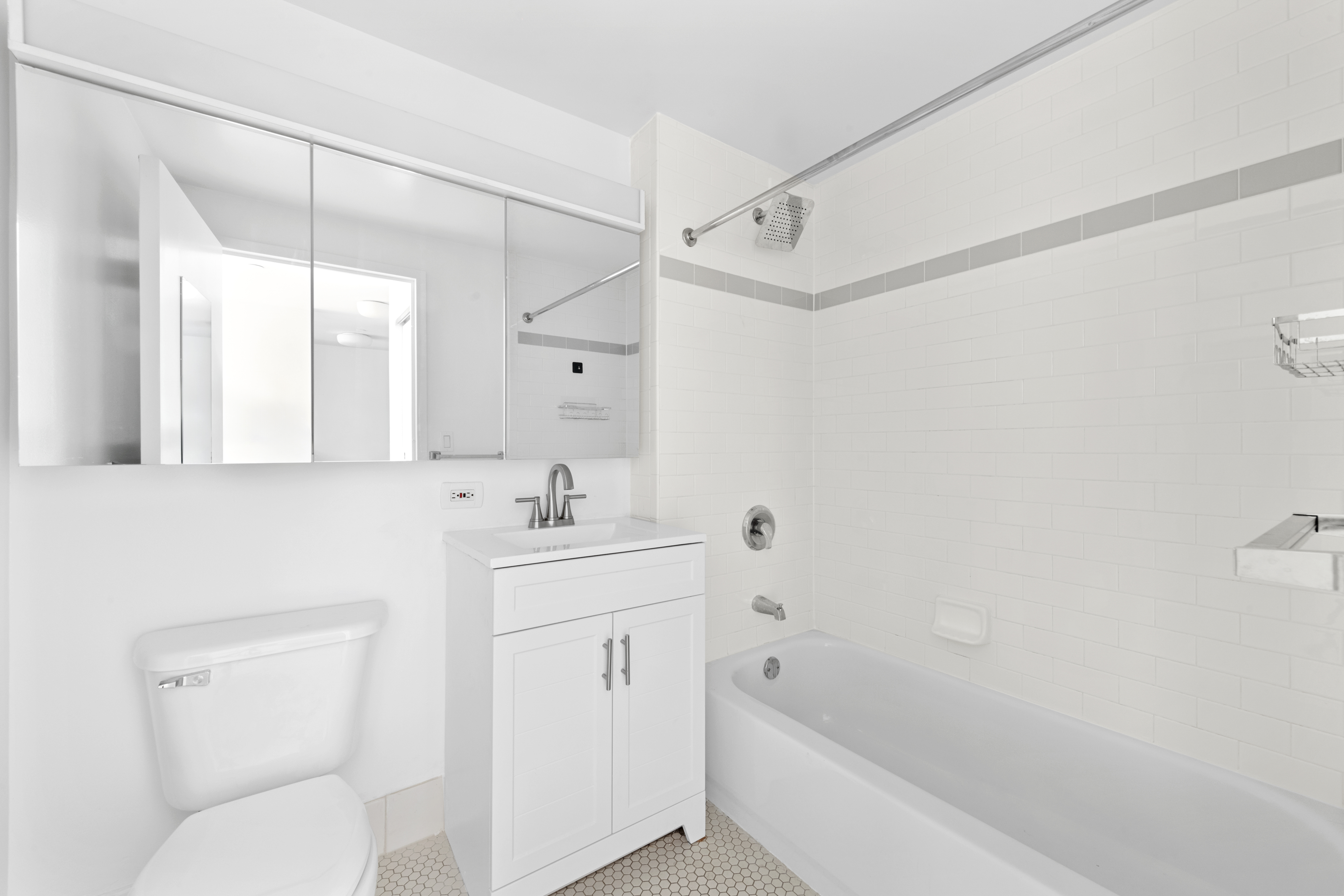 520 West 23rd Street, Unit 7E Manhattan, NY 10011 - Photo 5 of 9 a bathroom with a sink a toilet and shower